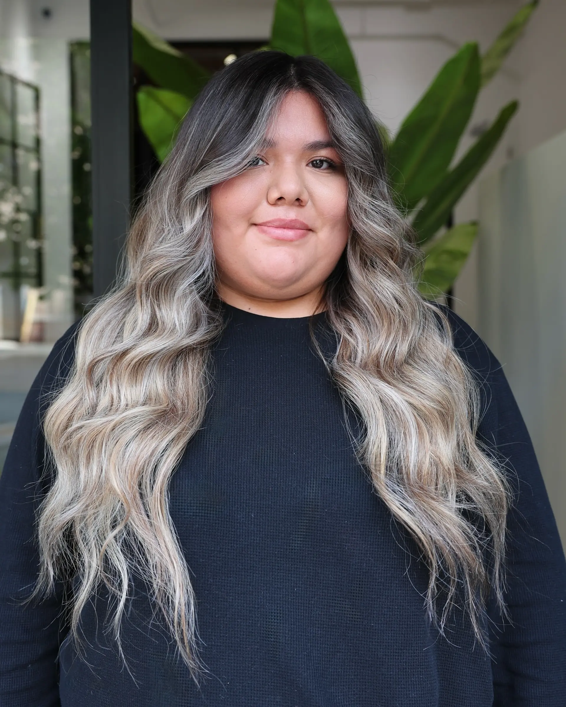 Long wavy hair with a seamless ash blonde balayage. 2