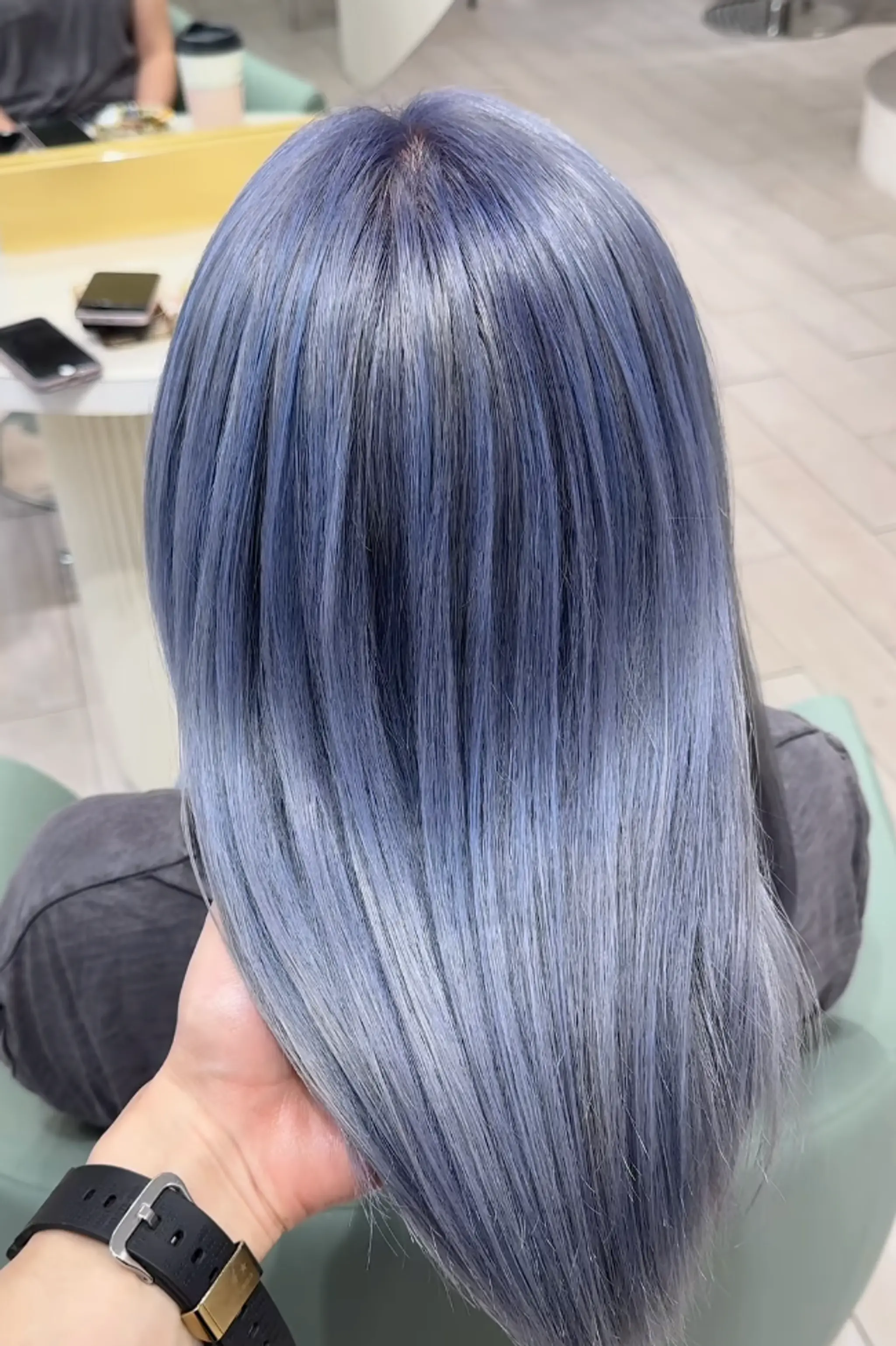 A sleek, medium-length, straight, silver-gray hairstyle with a metallic sheen and smooth texture arranged in even lines.

Stylist: @masaki.newyork 2