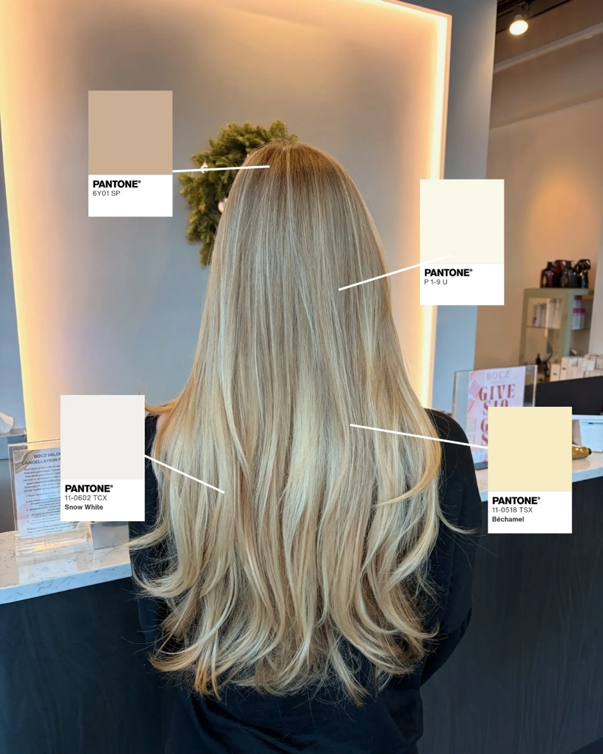Long hair featuring dimensional blonde highlights with seamless root blending and soft, layered ends. 1