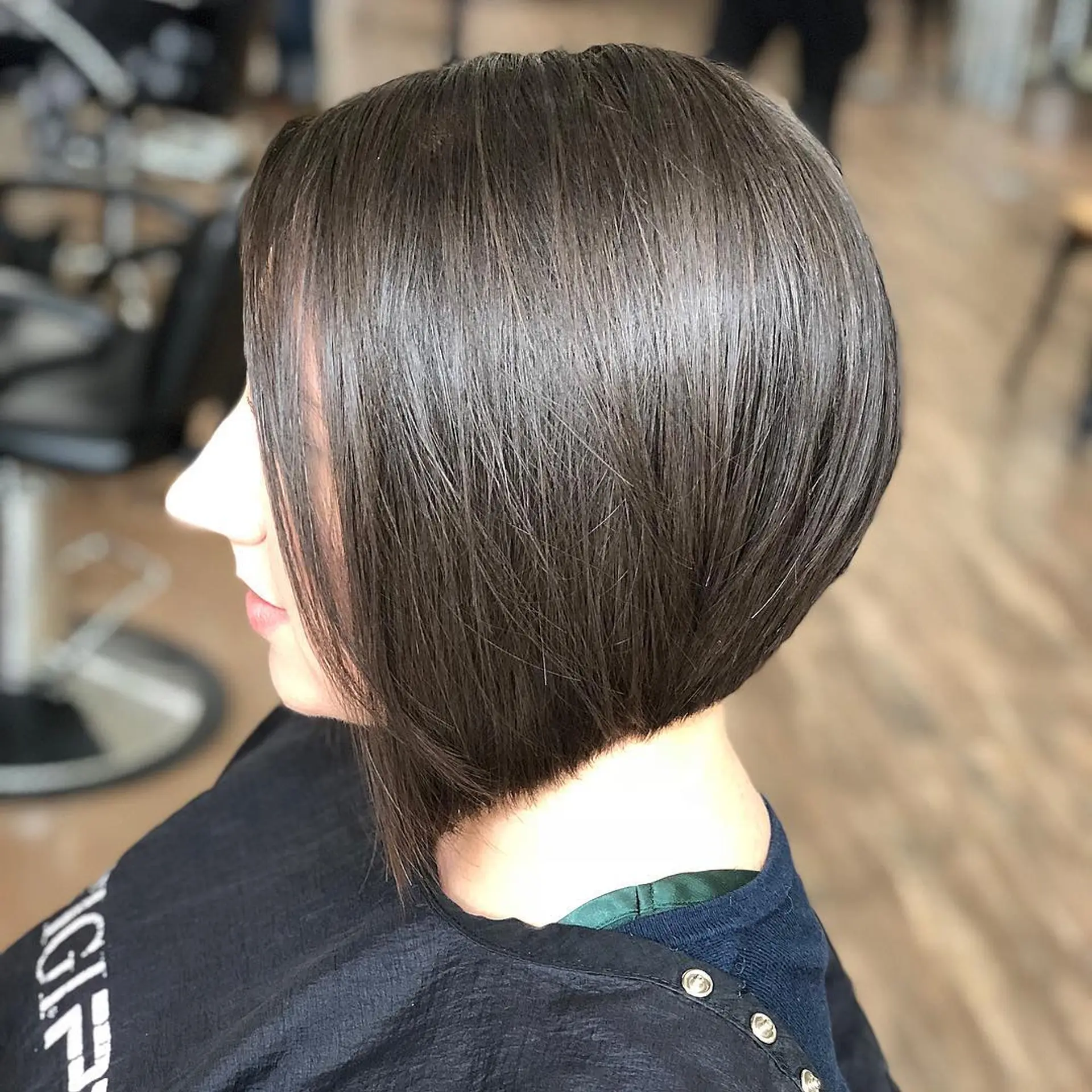 A sleek, sharp angled bob haircut cut precisely along the neckline. 1