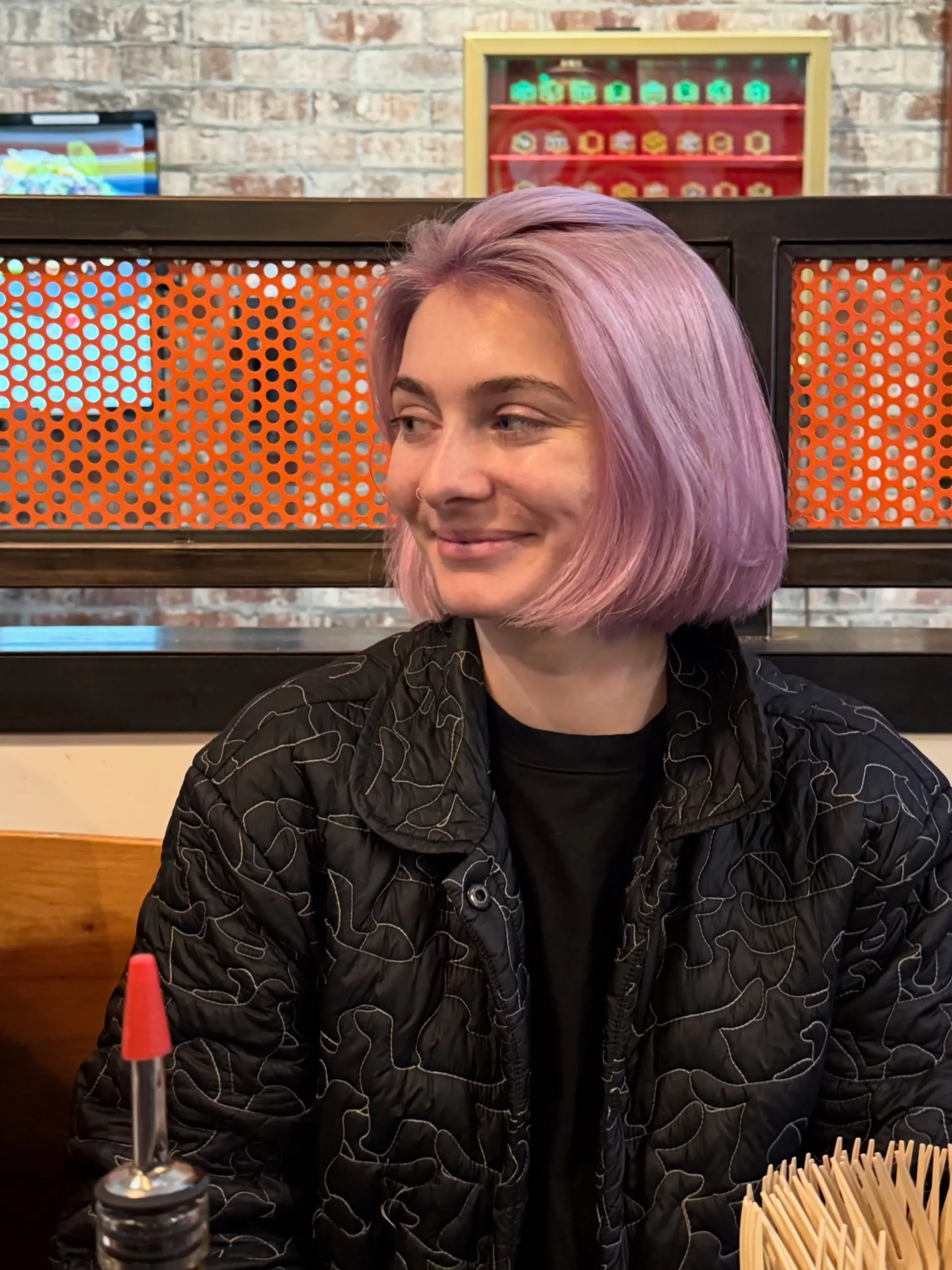A sleek chin-length blunt bob dyed in an all-over pastel lilac hue. 1