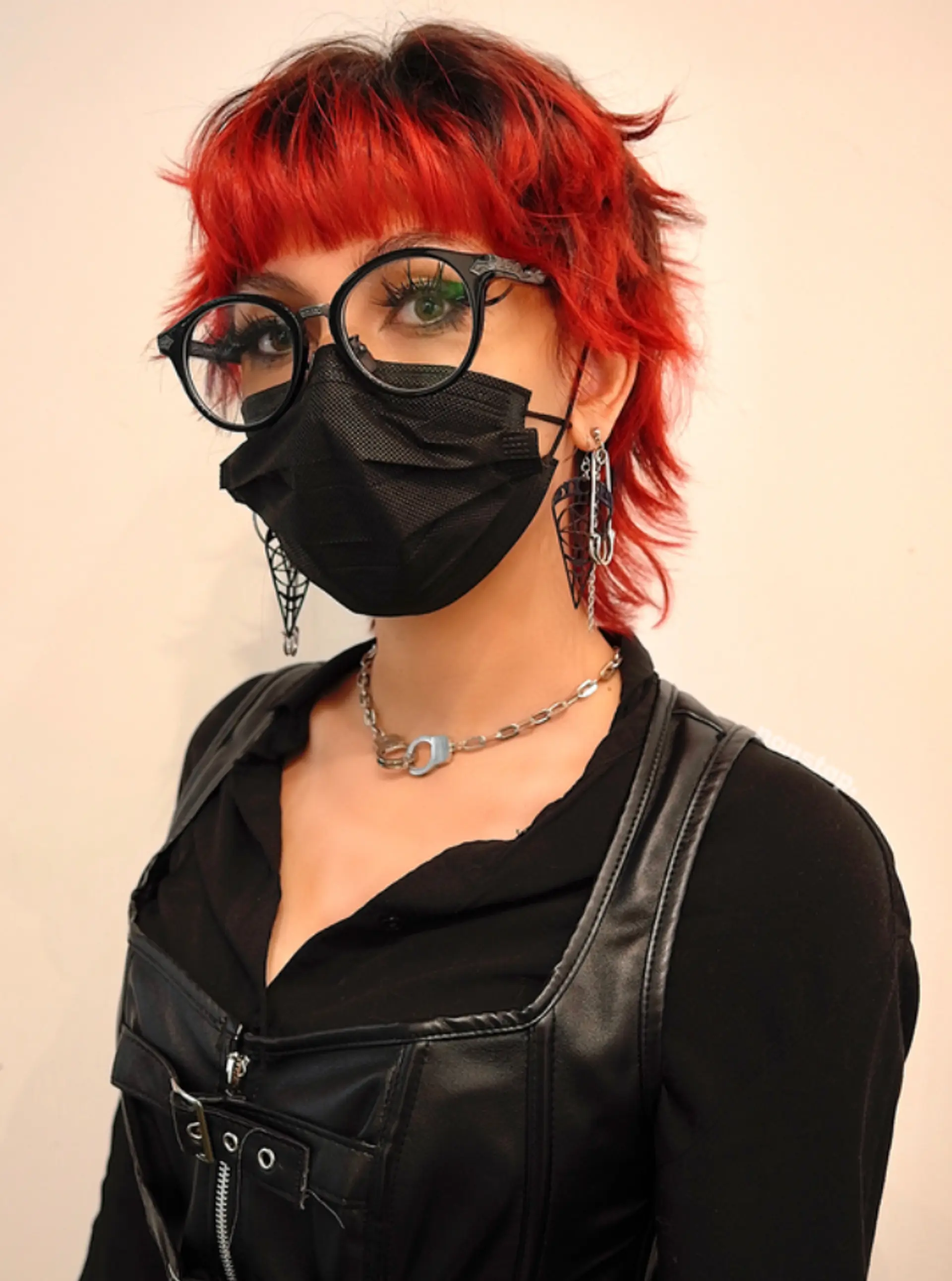 A striking, wavy, short haircut with vibrant red and black colors. It features layers and a choppy, shaggy texture with a bold fringe, giving an edgy vibe.
(NonstopStyle: by Kris) 2