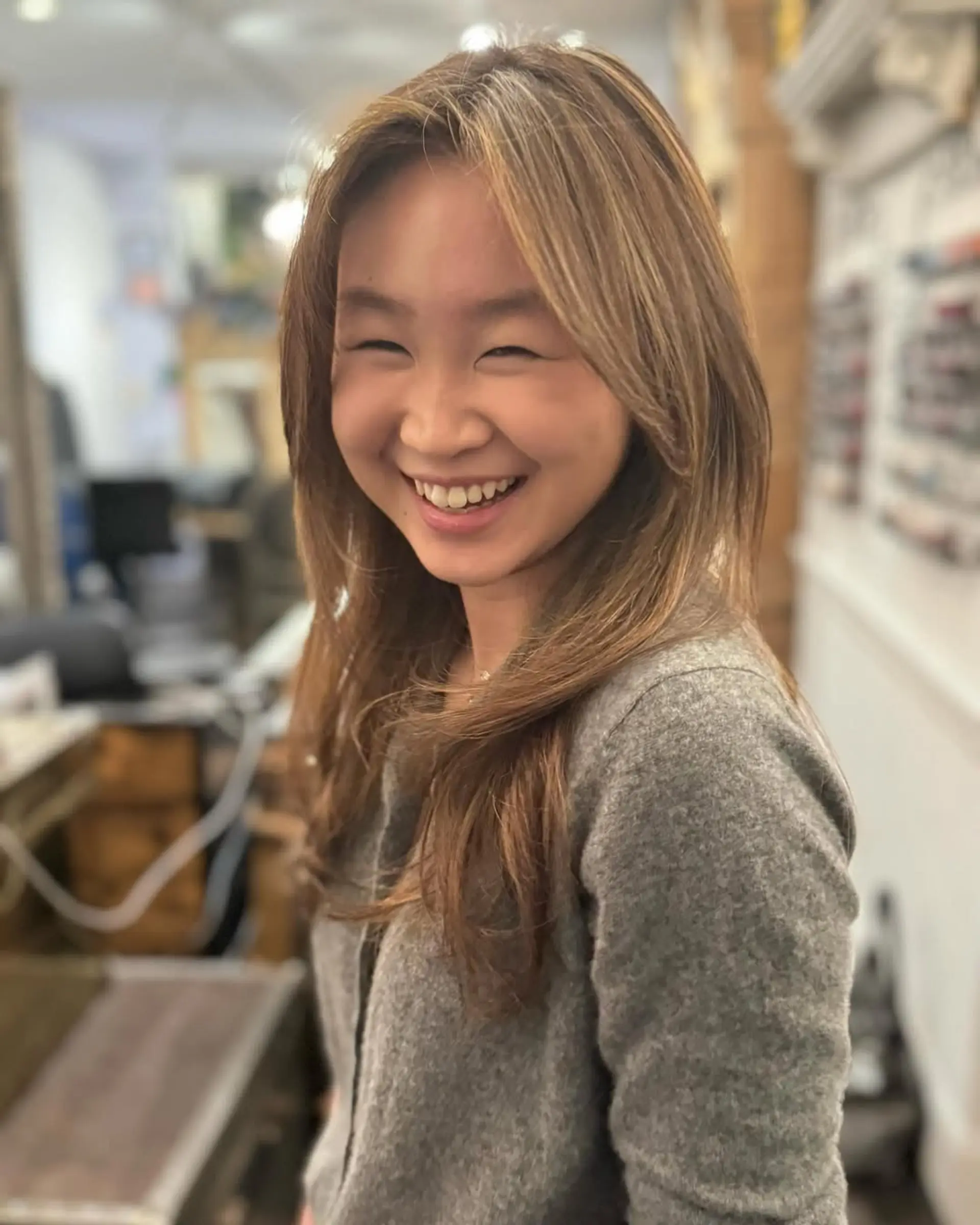 Long, straight, and sleek hair with rich brown and auburn highlights, featuring subtle layers for natural movement. 3