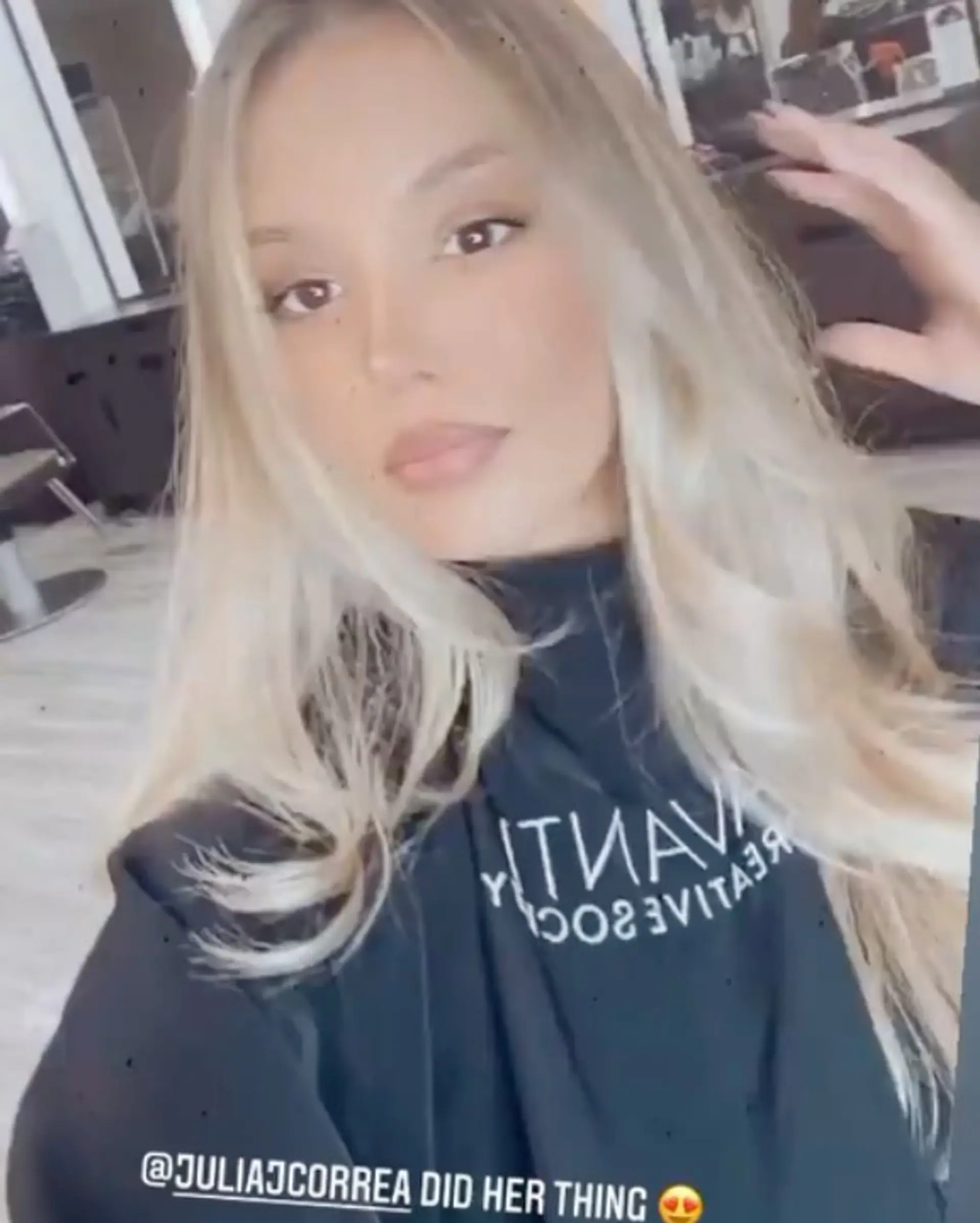 Seamless melted blonde balayage styled with soft, voluminous waves. 1