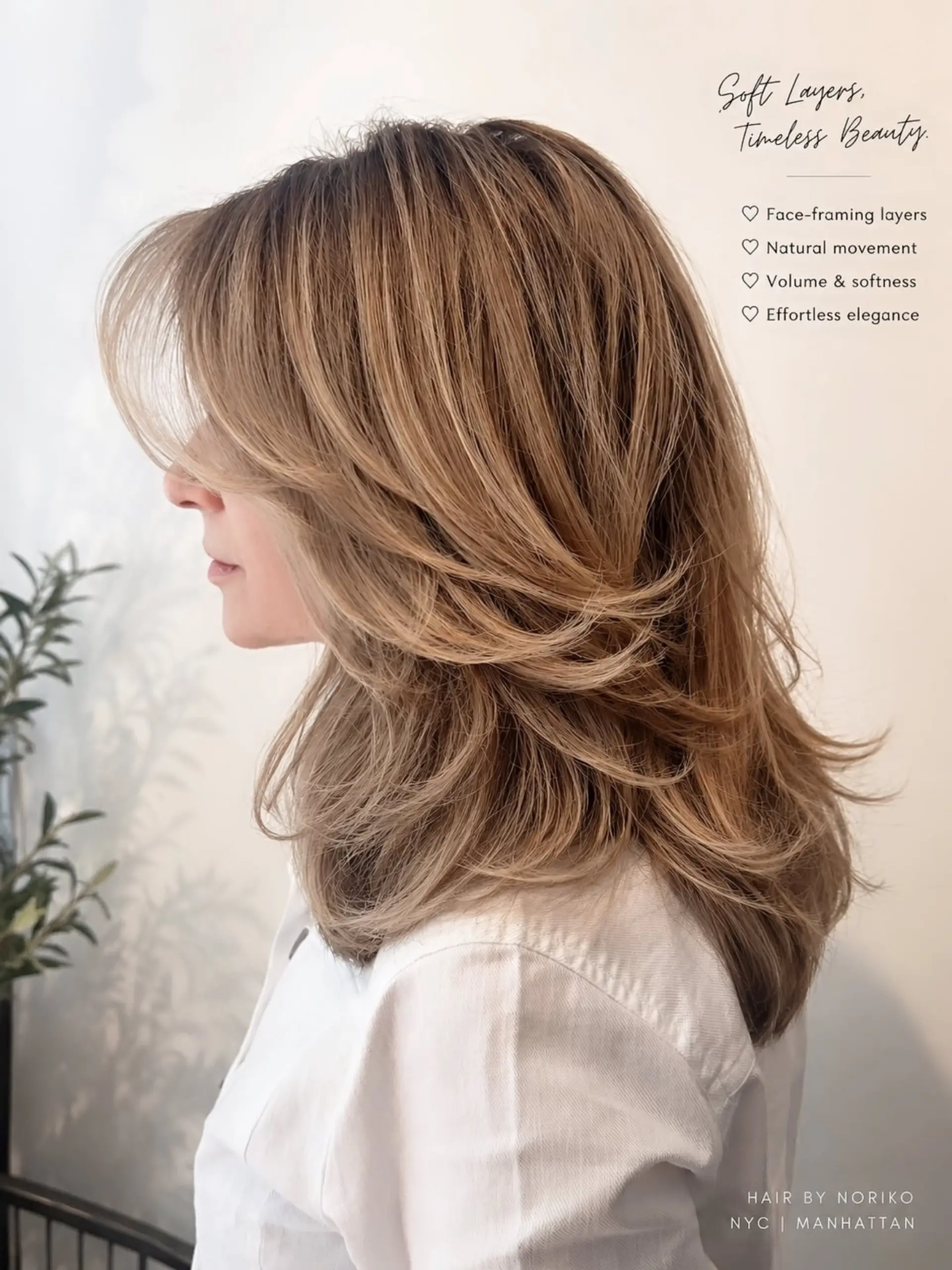 A medium-to-long haircut styled with soft, cascading face-framing layers and long curtain bangs, finished with an outward-flipped blowout. 1