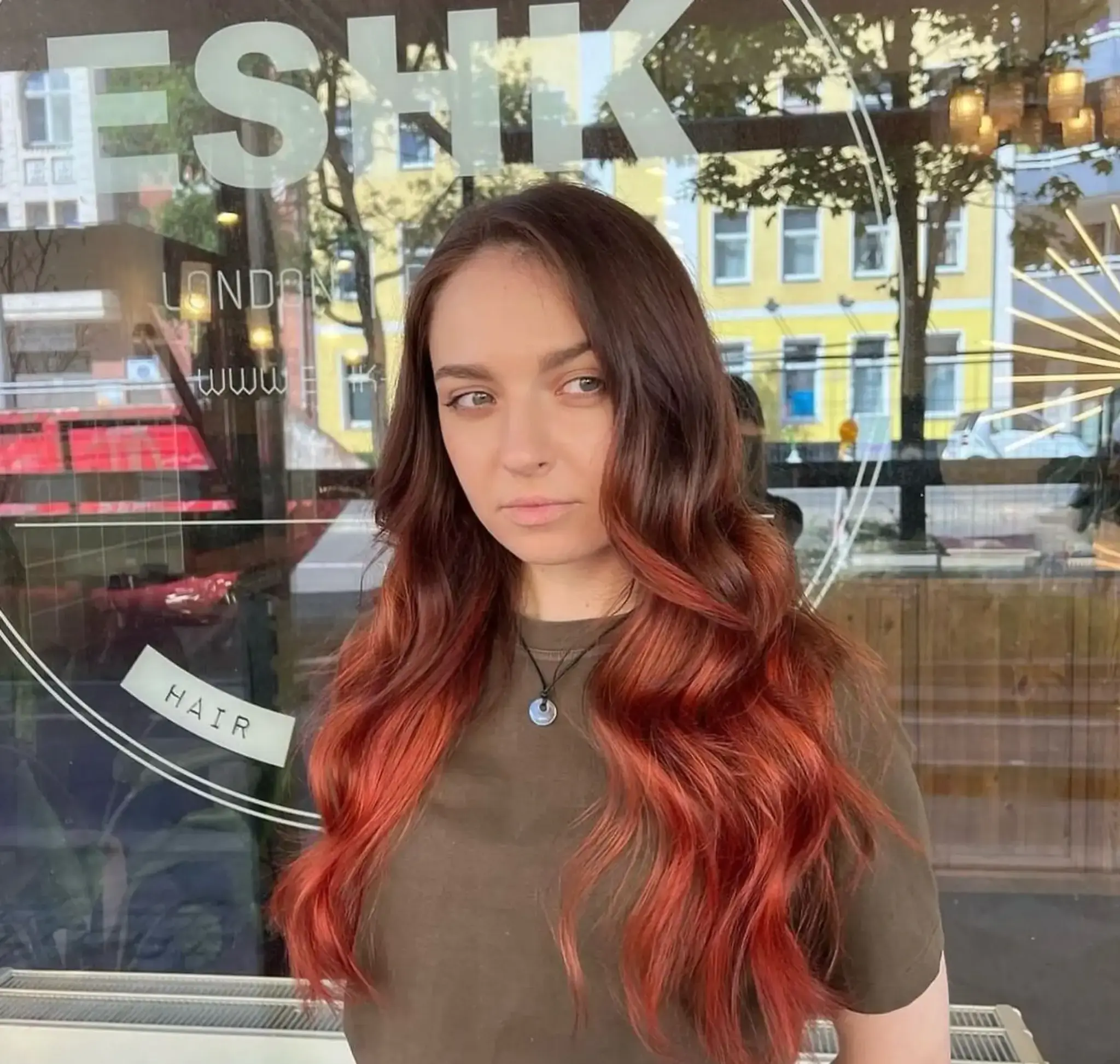 Very long, wavy hair with a dark brown to copper red ombre transition.