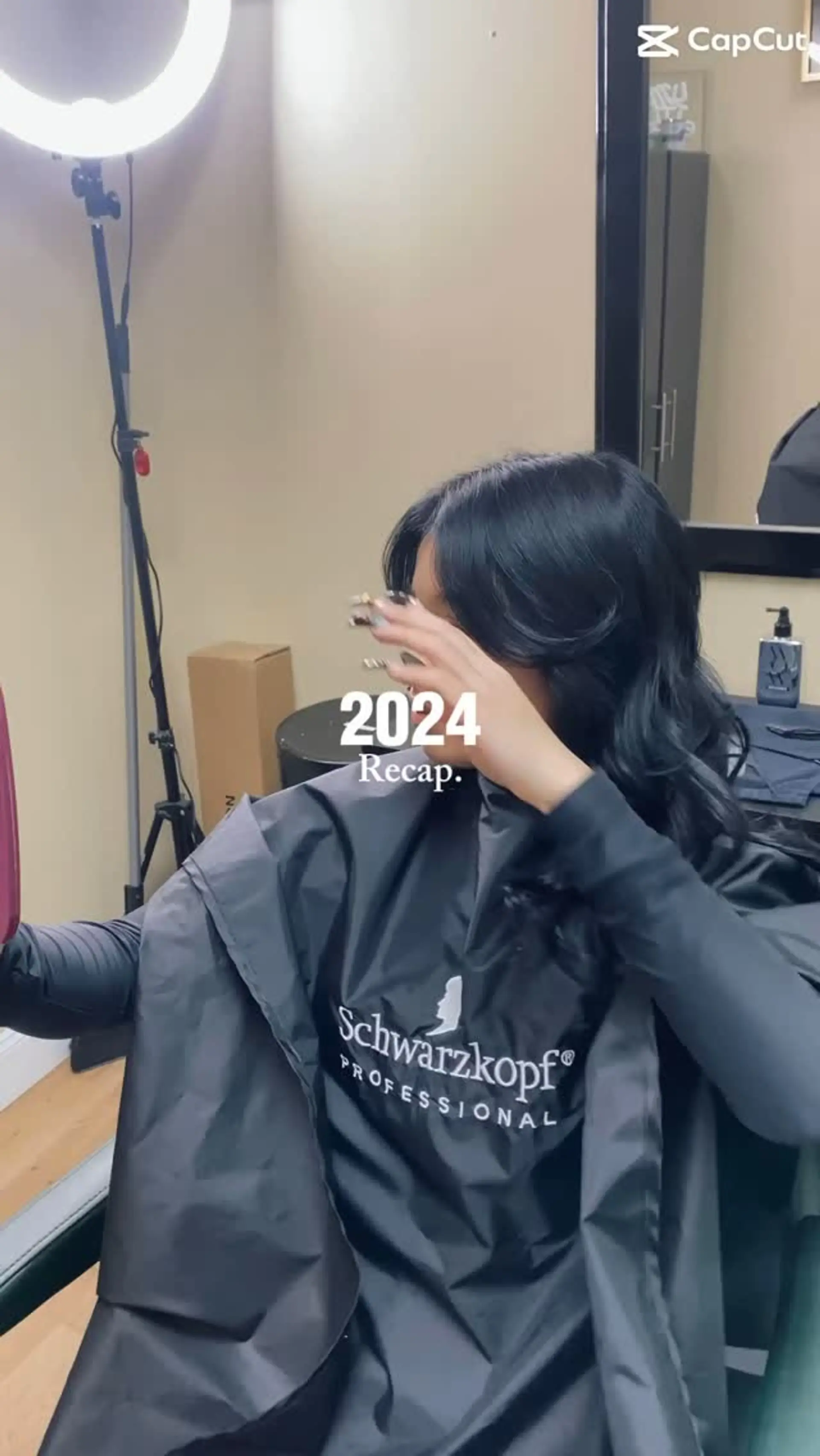 Medium-length jet black hair styled into a silky, voluminous blowout with soft face-framing waves. 1