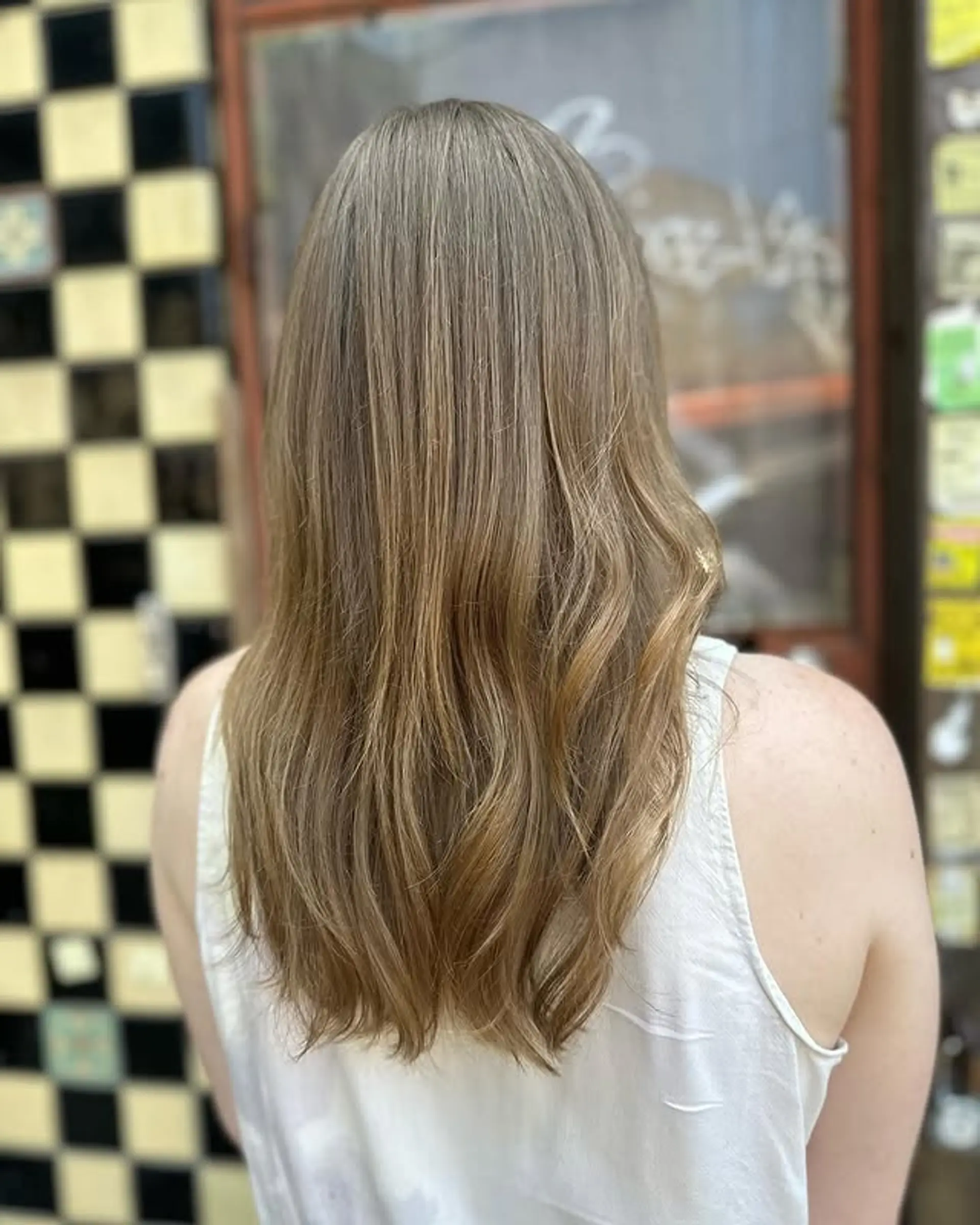 A long layered bronde balayage with subtle waves 1