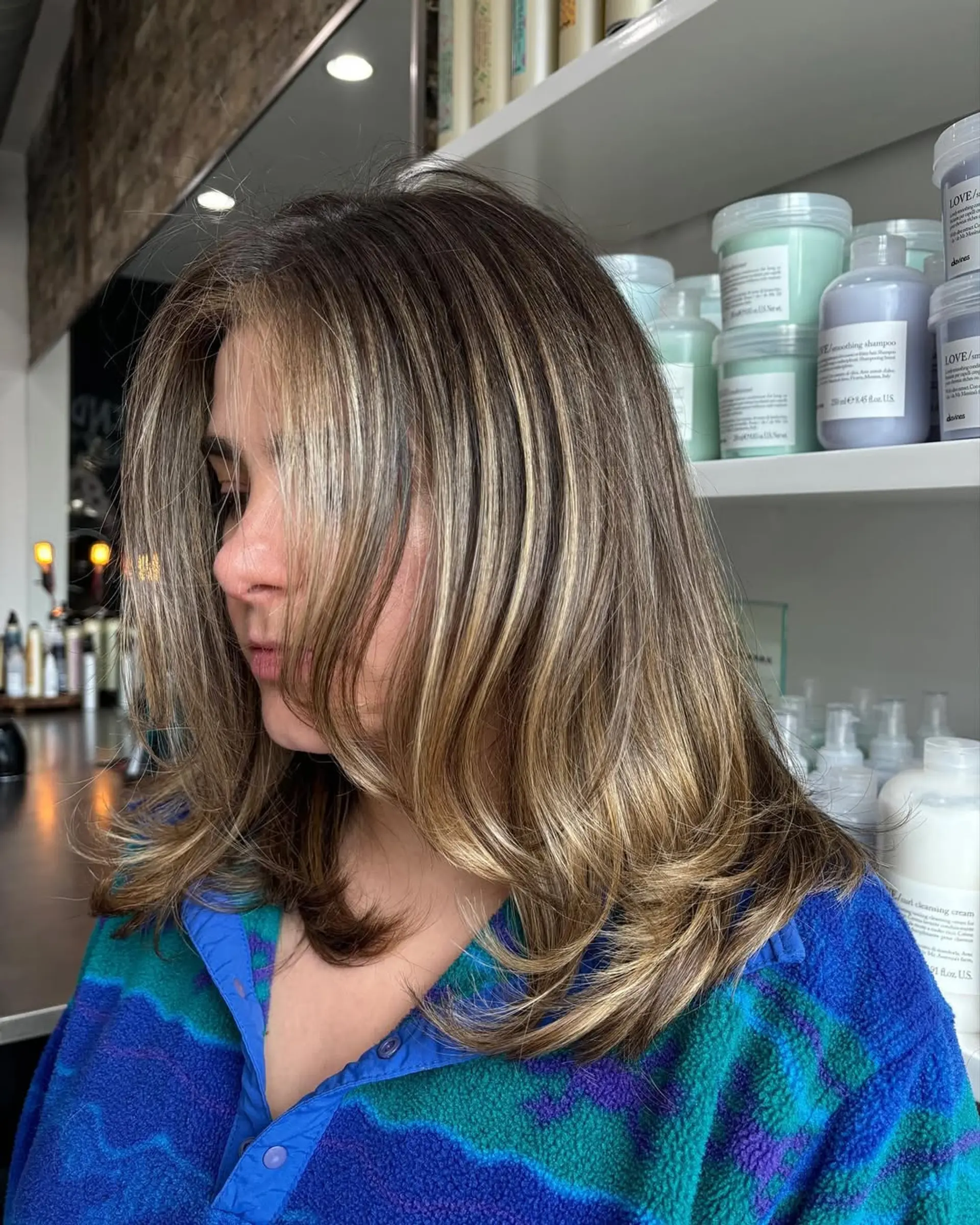 Medium-length straight hair with natural roots transitioning into dimensional ash and golden blonde balayage highlights, finished with soft layers. 2