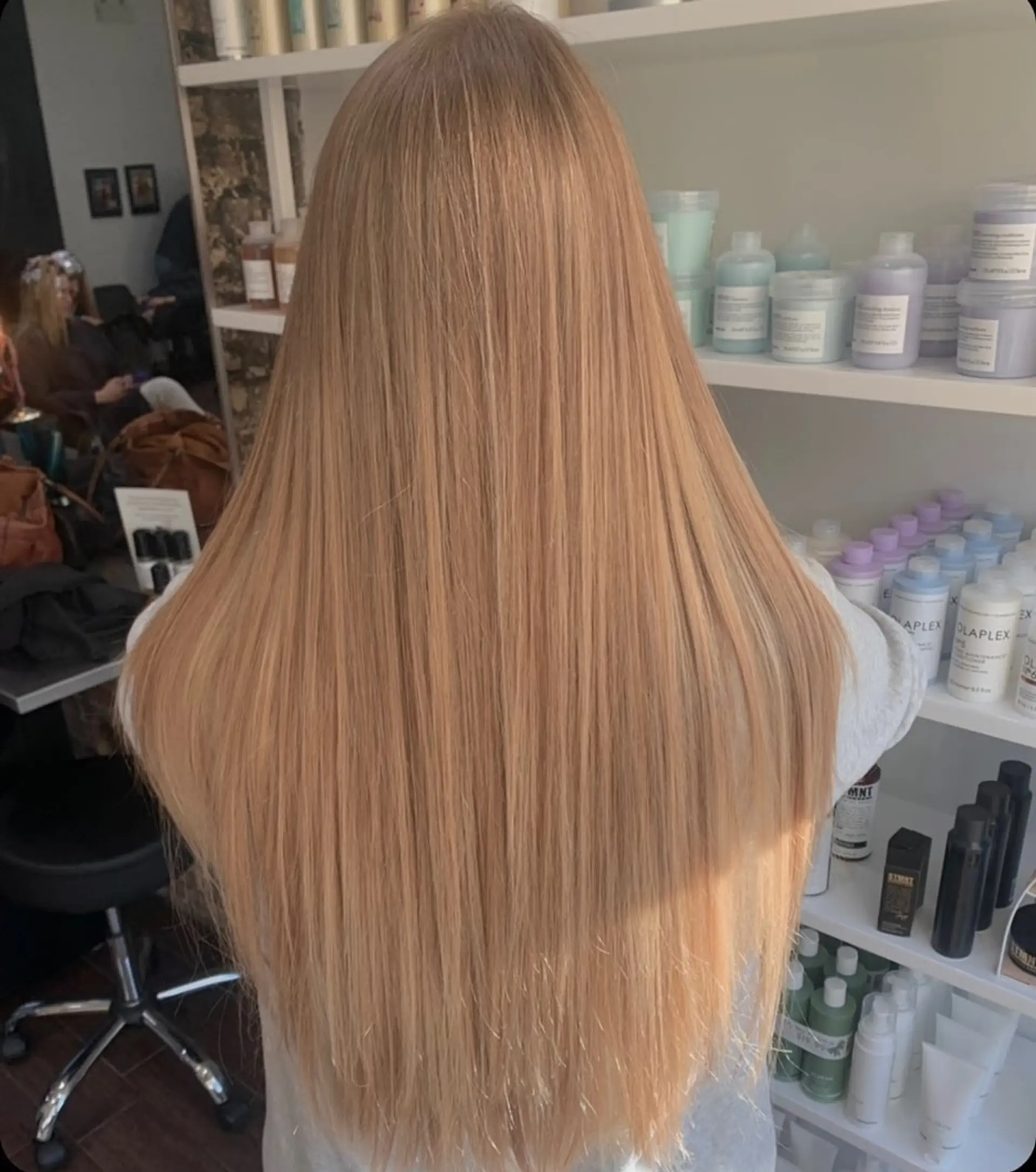 A stunning, very long and straight hairstyle featuring a rich, luminous golden blonde color that radiates warmth and shine. 1