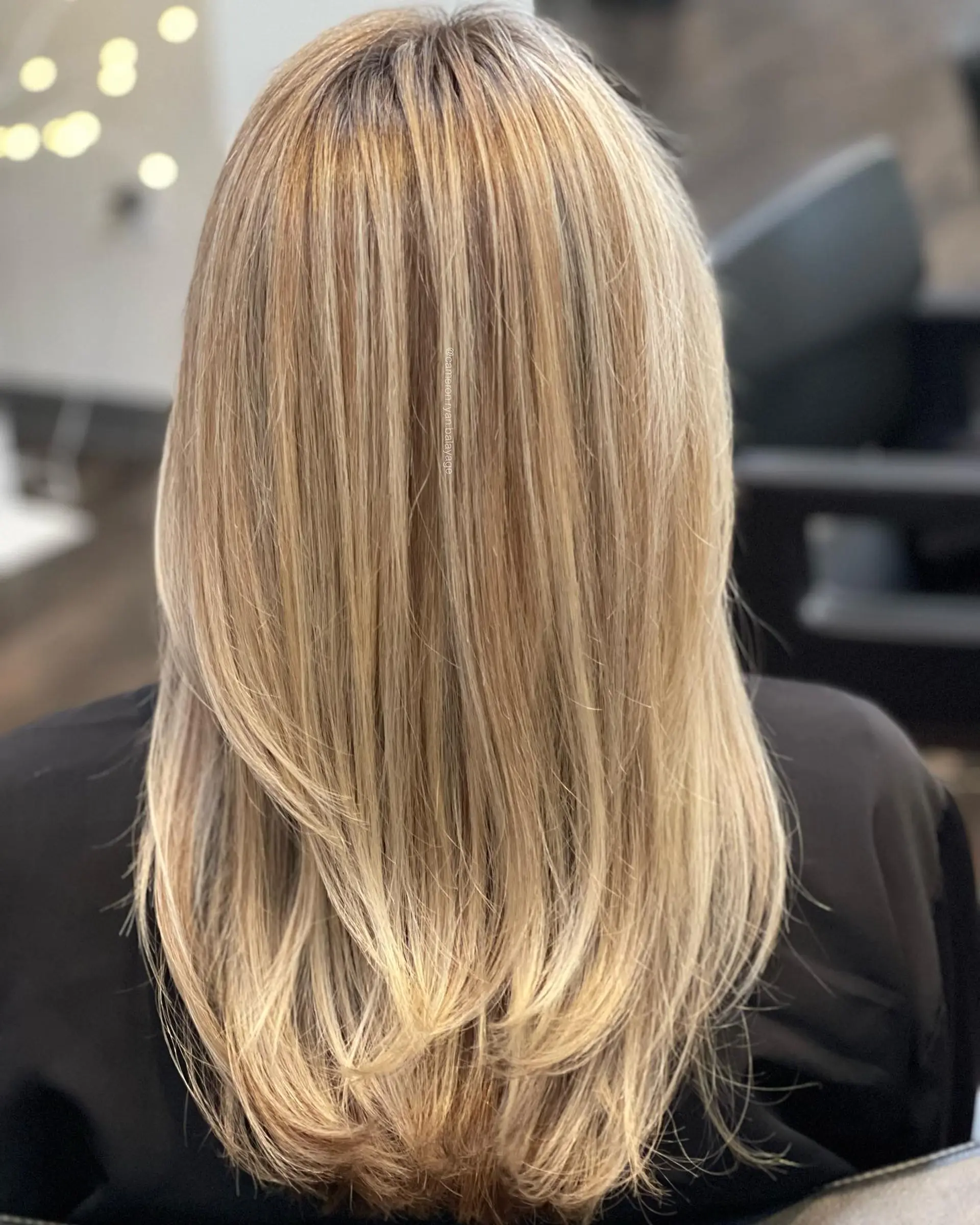 Straight, multi-tonal blonde hair with blended highlights and subtle layered ends curved inward. 1