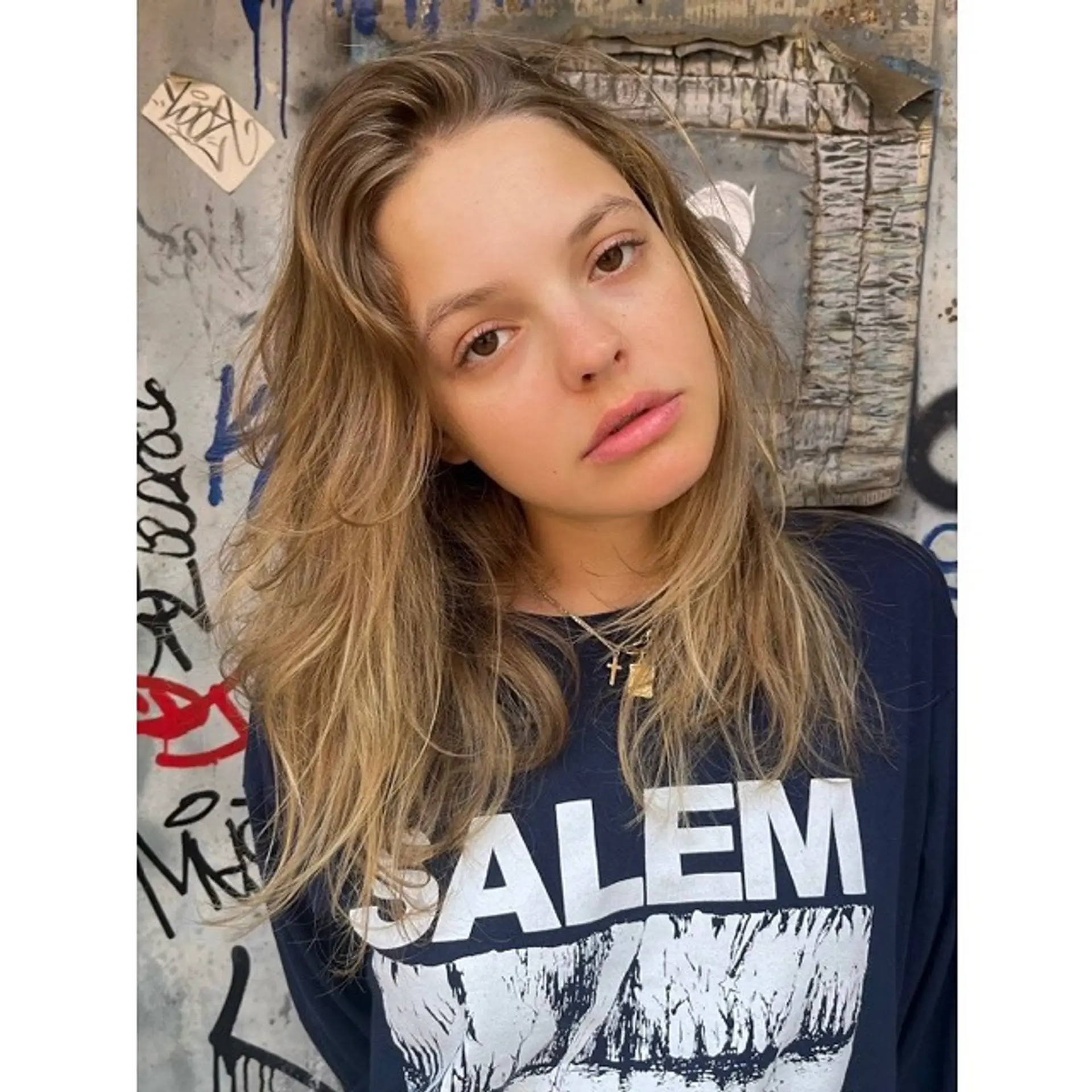 Long, wavy hair with beachy waves and face-framing layers. 1