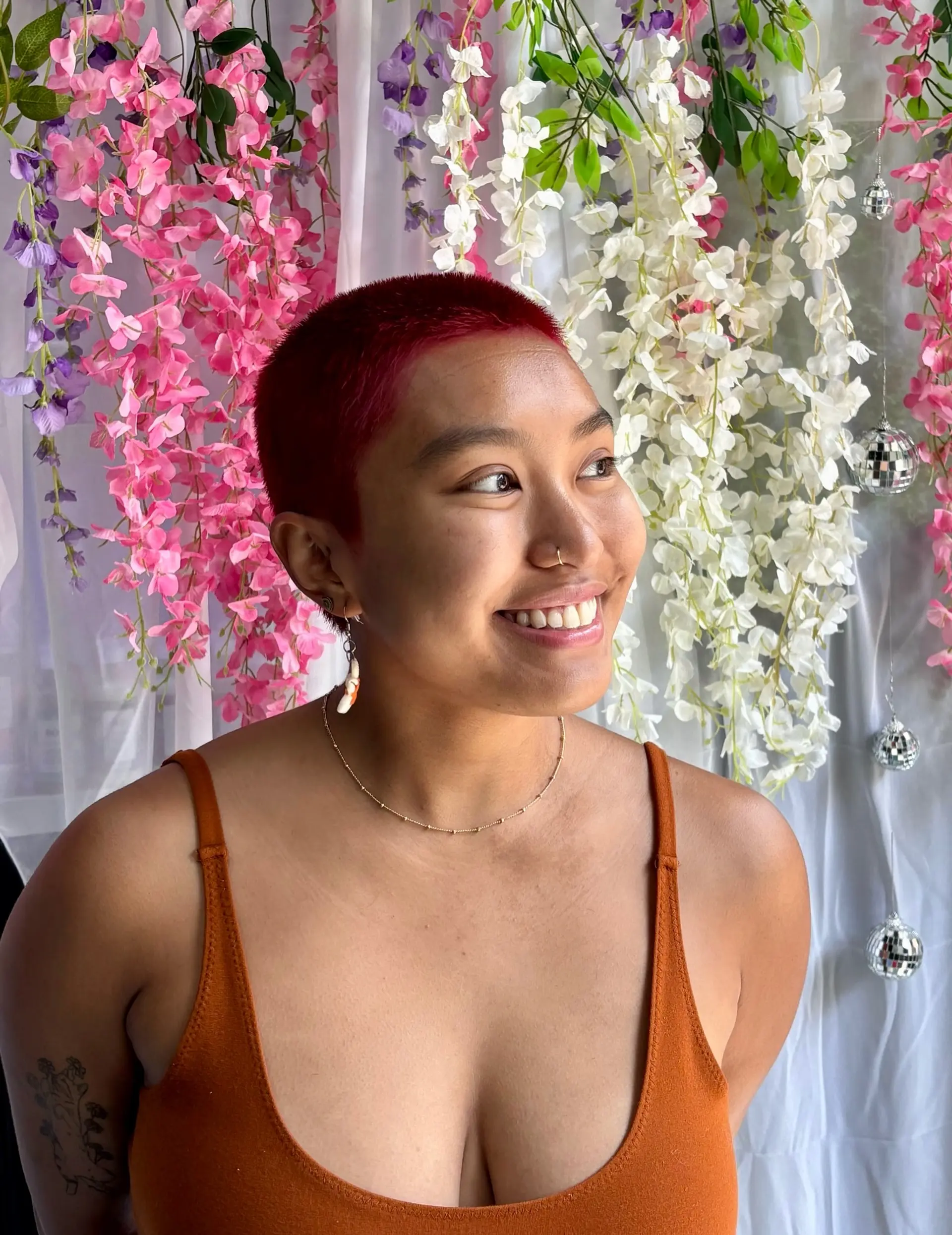 A stylish buzz cut with a vibrant, red color. 1