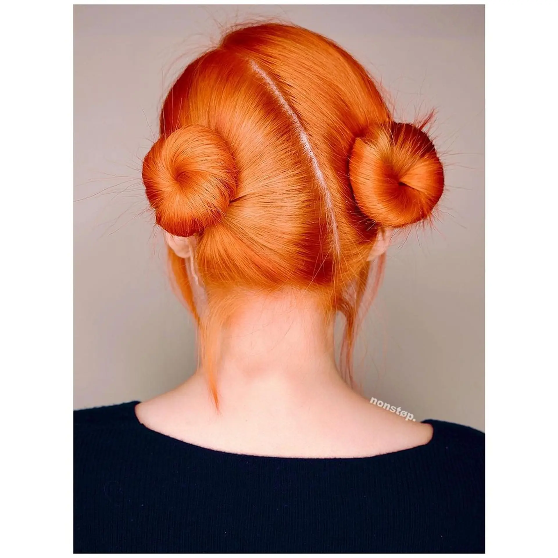 Two symmetrical, tight buns with a middle part on straight, medium-length, red-orange hair. (NonstopStyle: by Vincent) 1