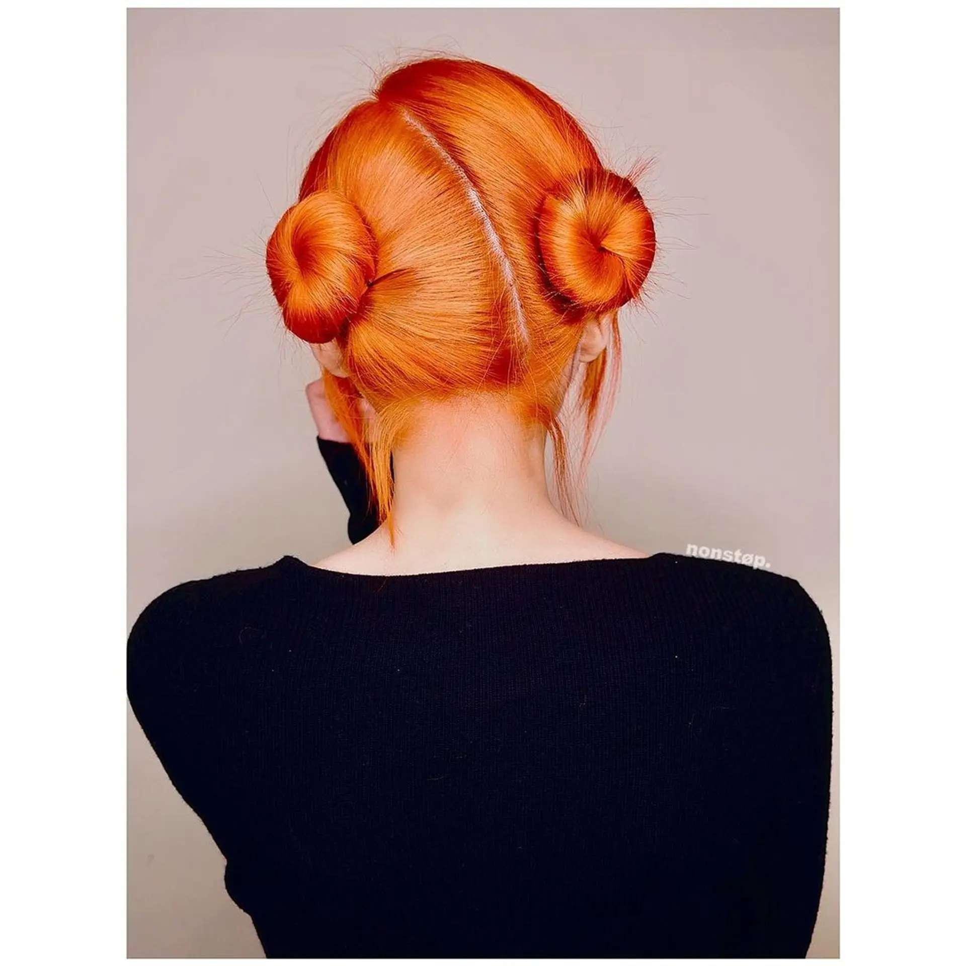 Two symmetrical, tight buns with a middle part on straight, medium-length, red-orange hair. (NonstopStyle: by Vincent) 2