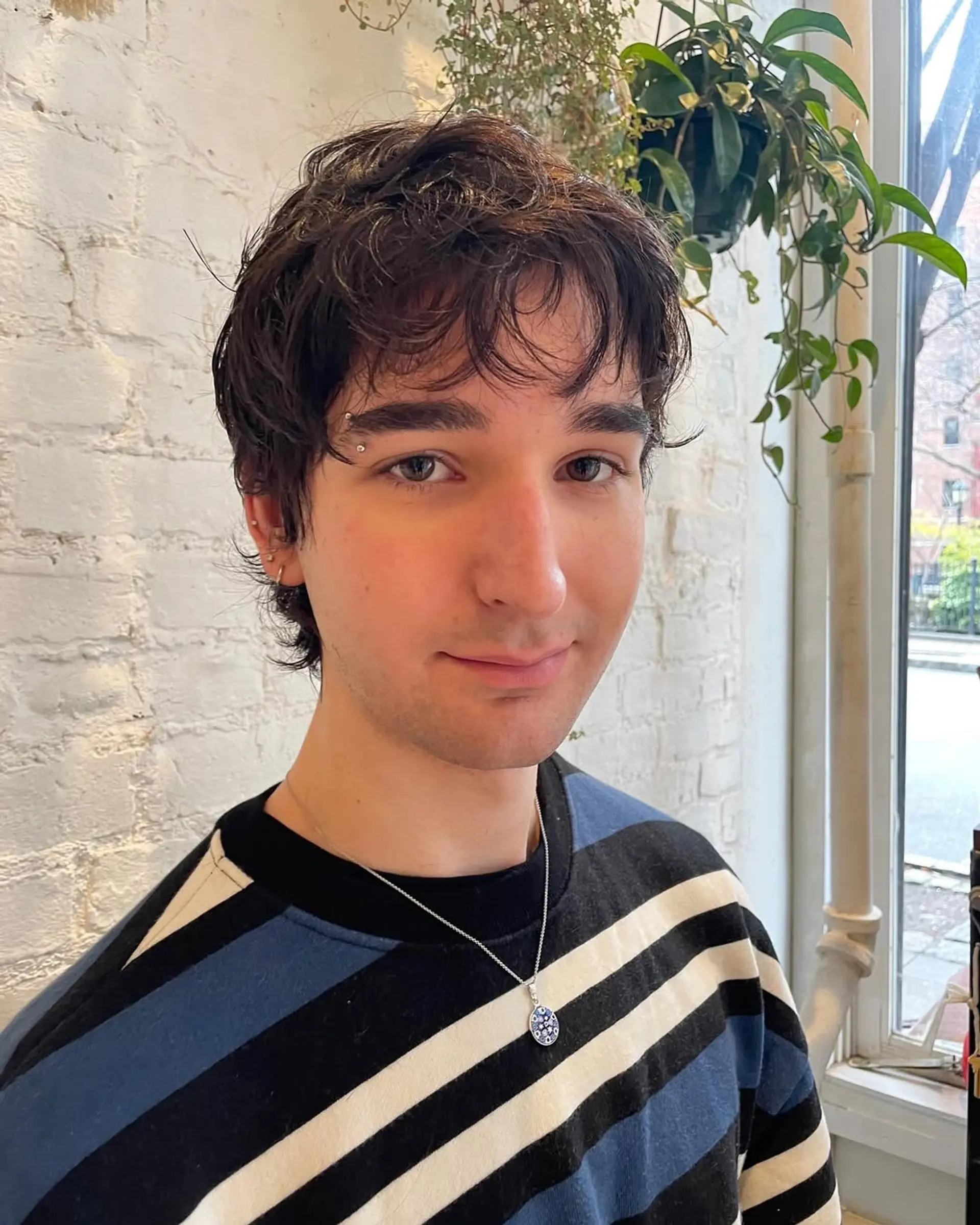 A textured, short crop haircut with natural waves. Provides a relaxed and effortless style. 2