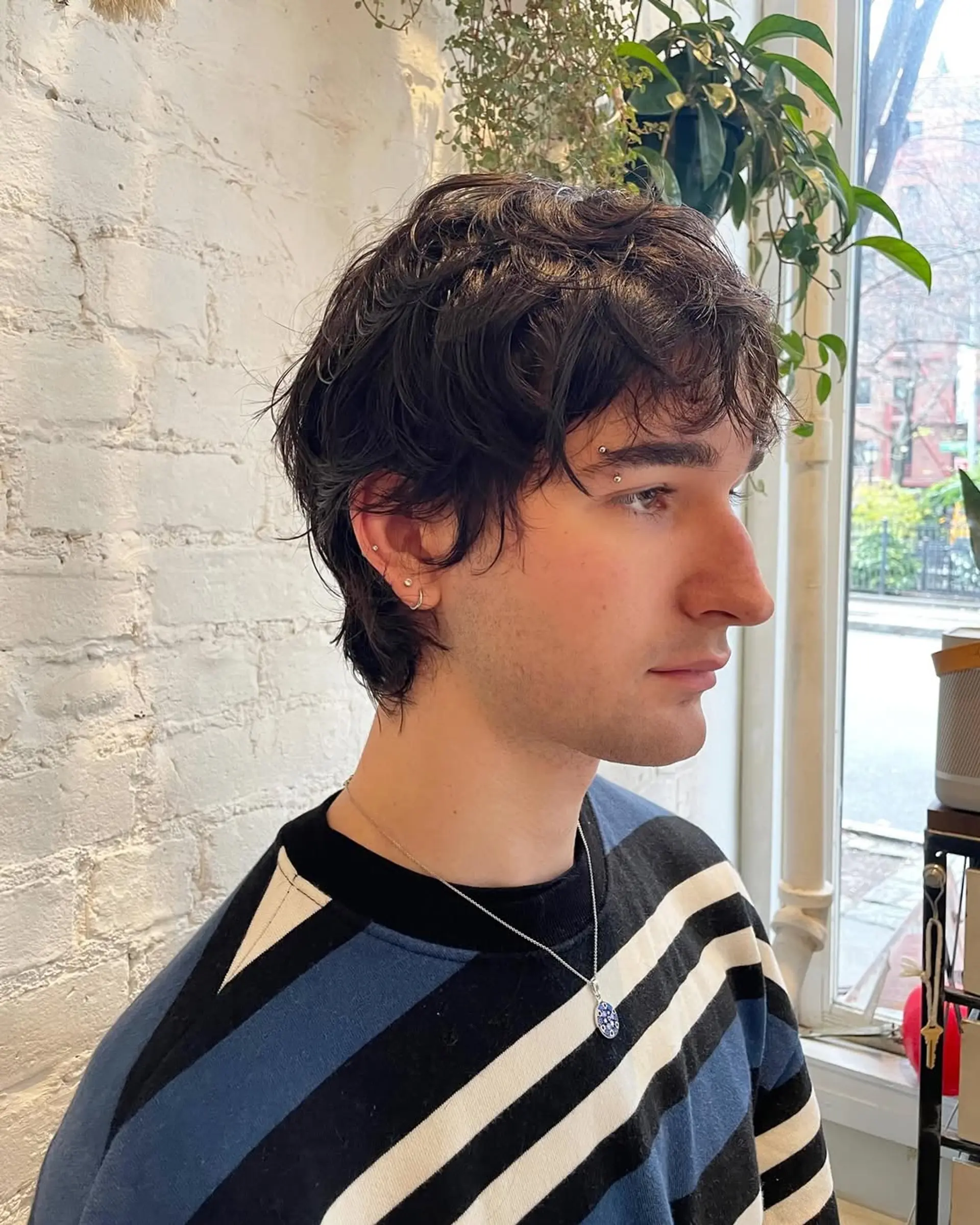 A textured, short crop haircut with natural waves. Provides a relaxed and effortless style. 3