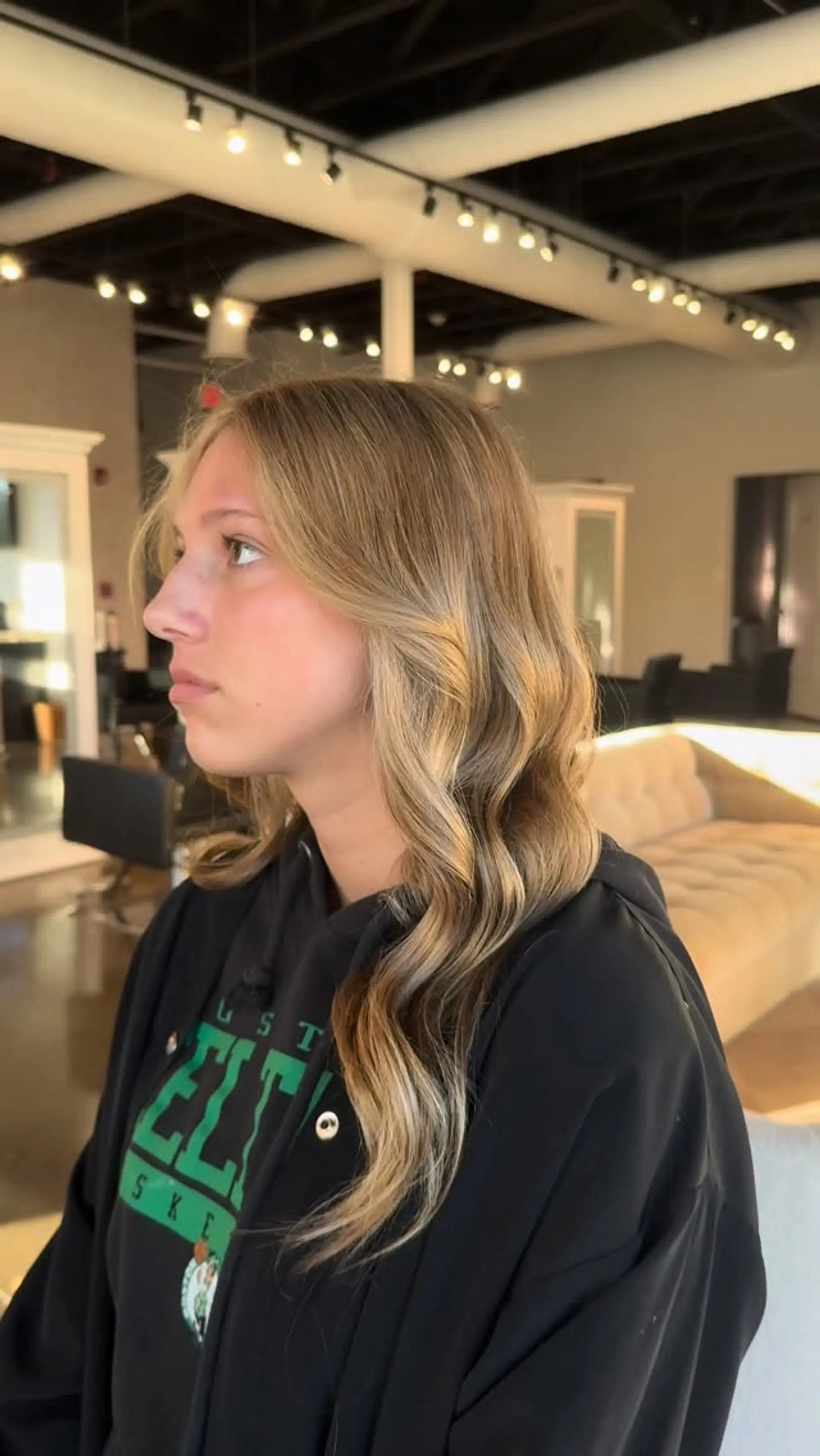 Long dimensional golden blonde hair styled with soft, loose waves and face-framing pieces. 1