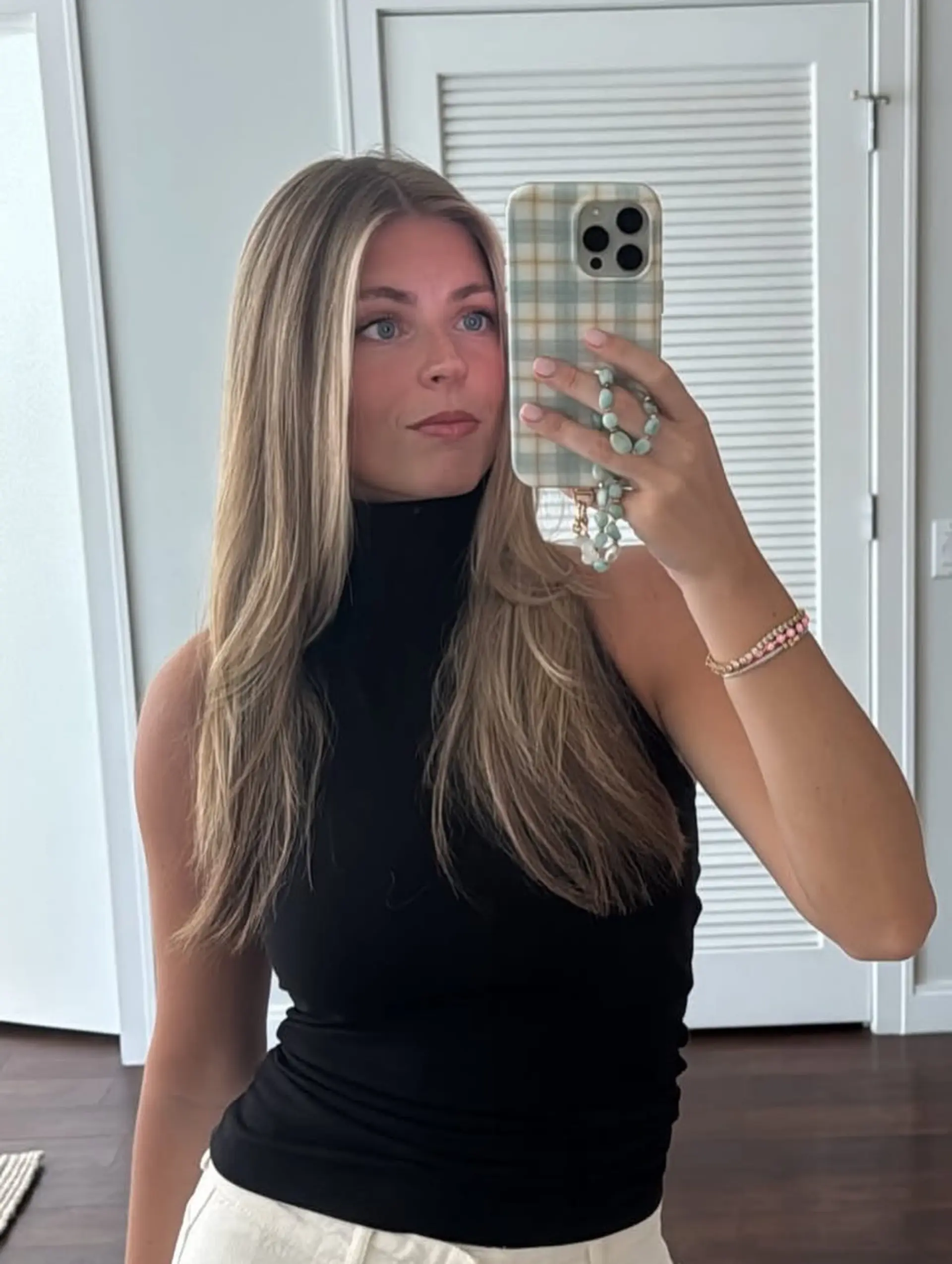 Long straight hair with gentle face-framing layers and a smooth blowout finish featuring lived-in blonde tones. 1