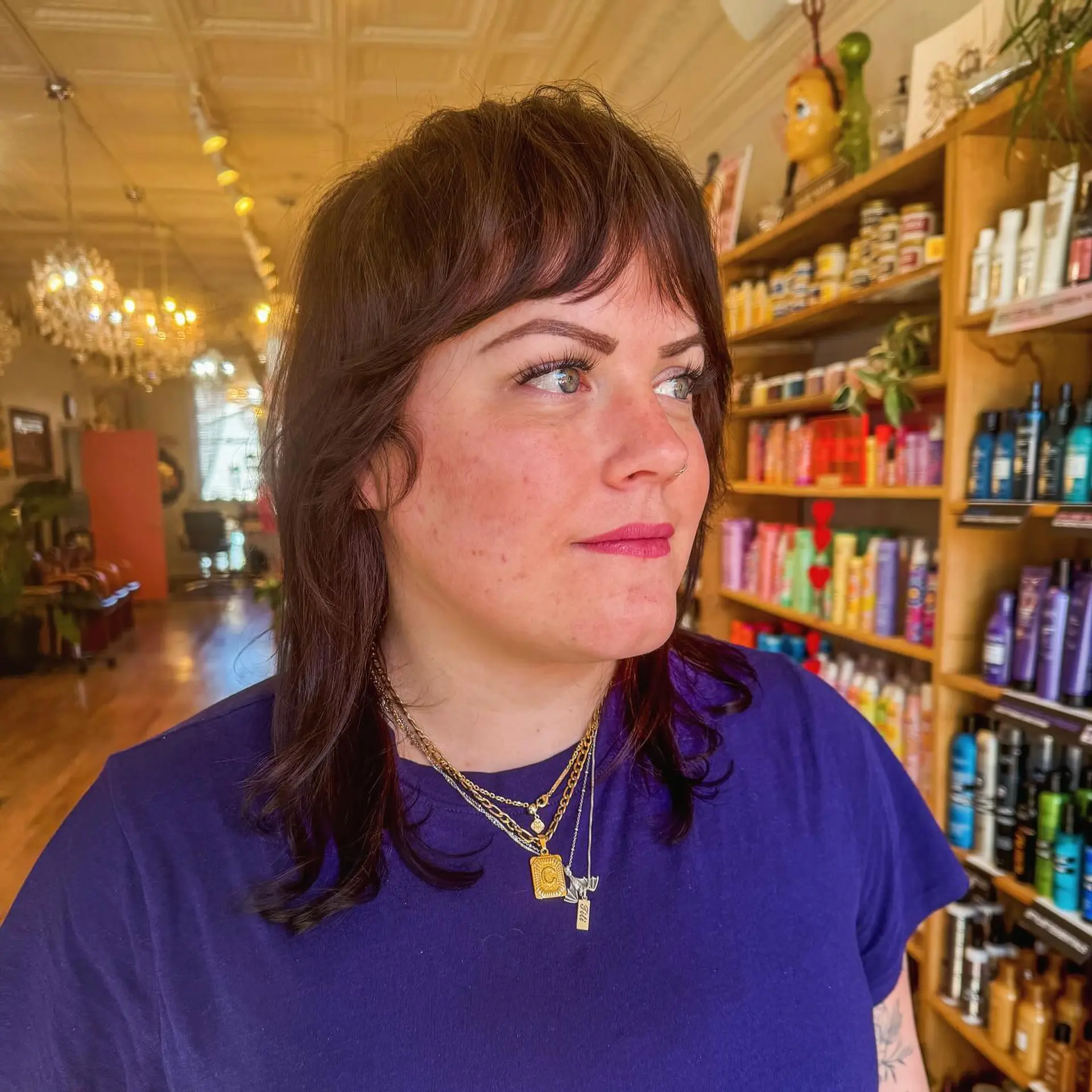 A modern shag haircut with layers and curtain bangs, perfect for adding texture and movement to wavy hair. 1