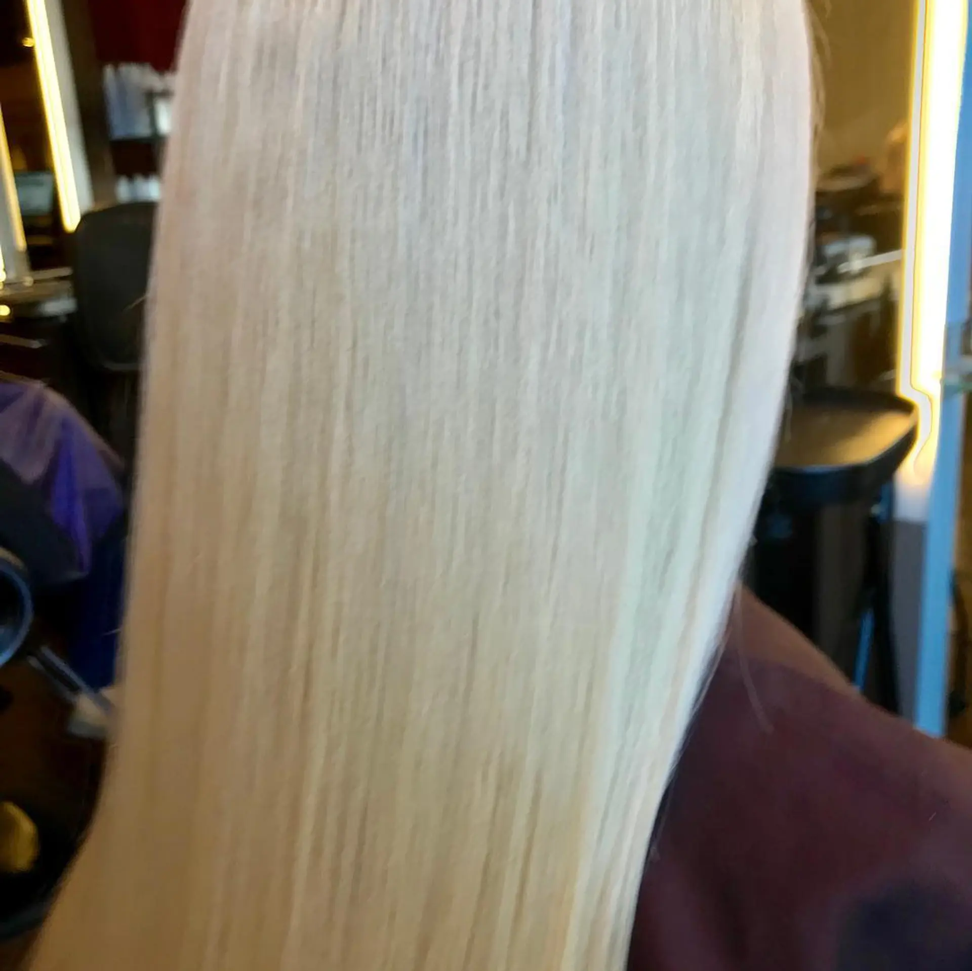Long, straight platinum blonde hair. 1
