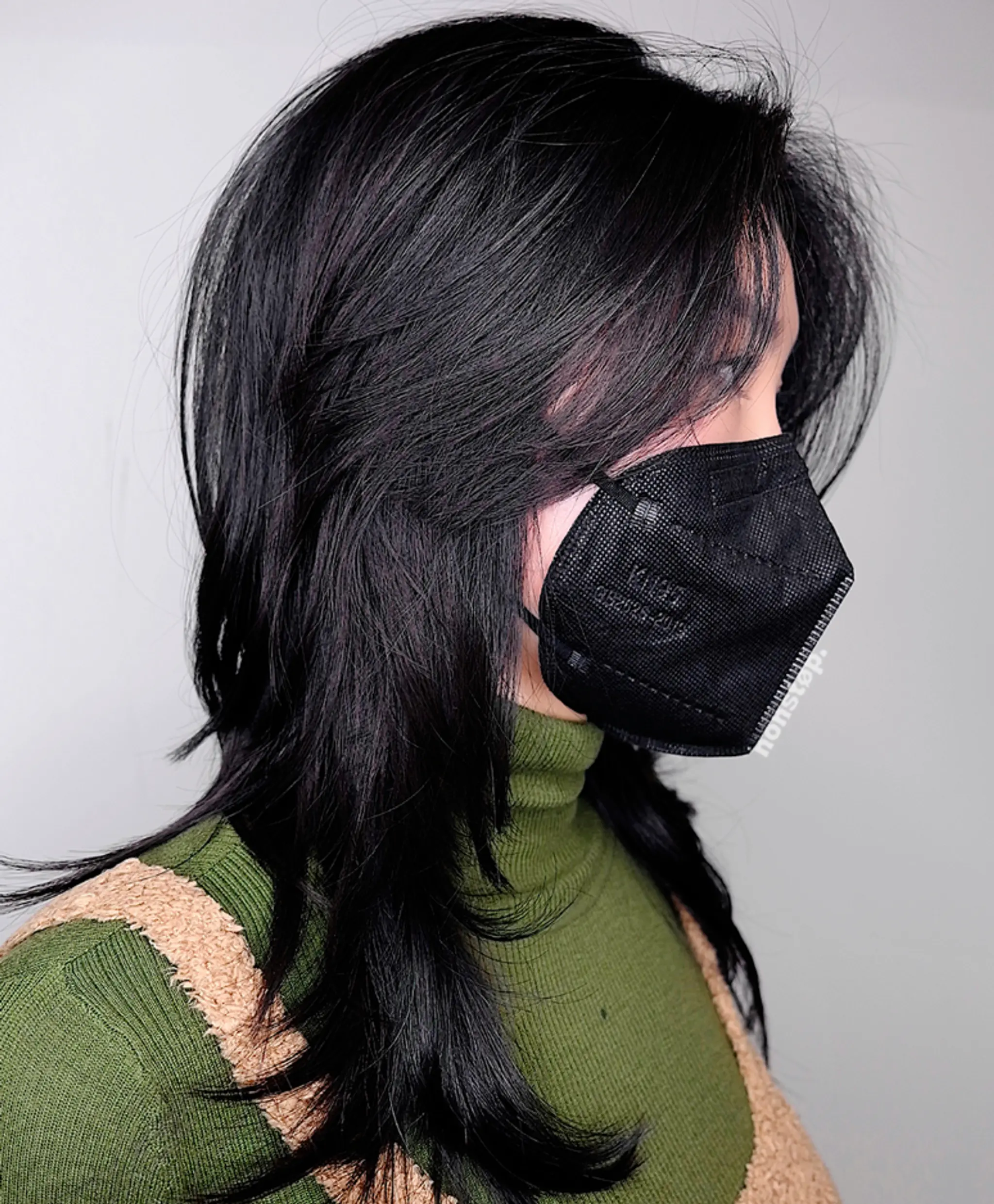 Long, straight, black hair with layered lengths, side bangs, and a sleek, glossy finish.