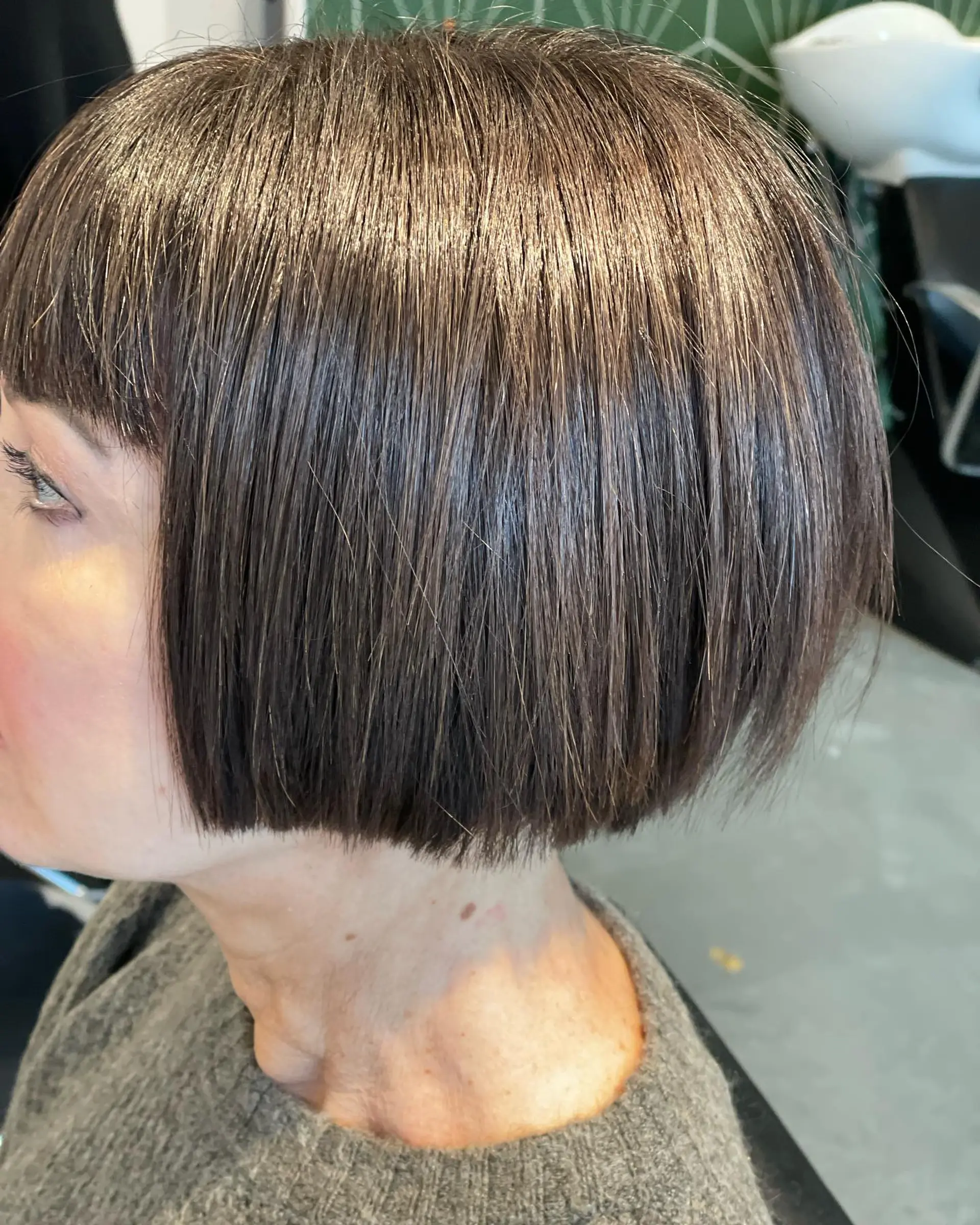 A sleek, chin-length blunt French bob paired with straight across bangs. 1
