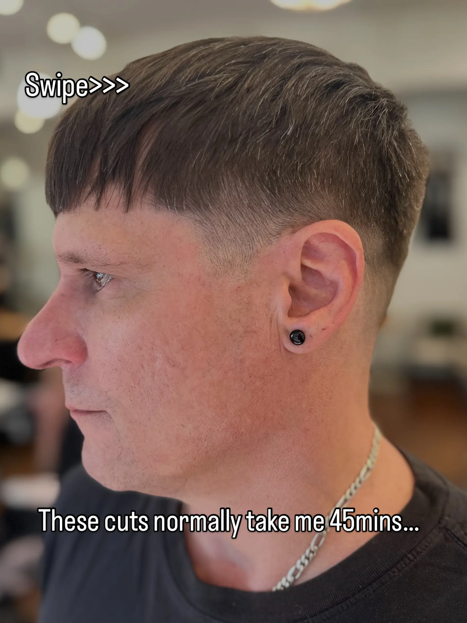 A modern textured crop haircut featuring a low taper fade around the ear and clean, textured blunt fringe. 1