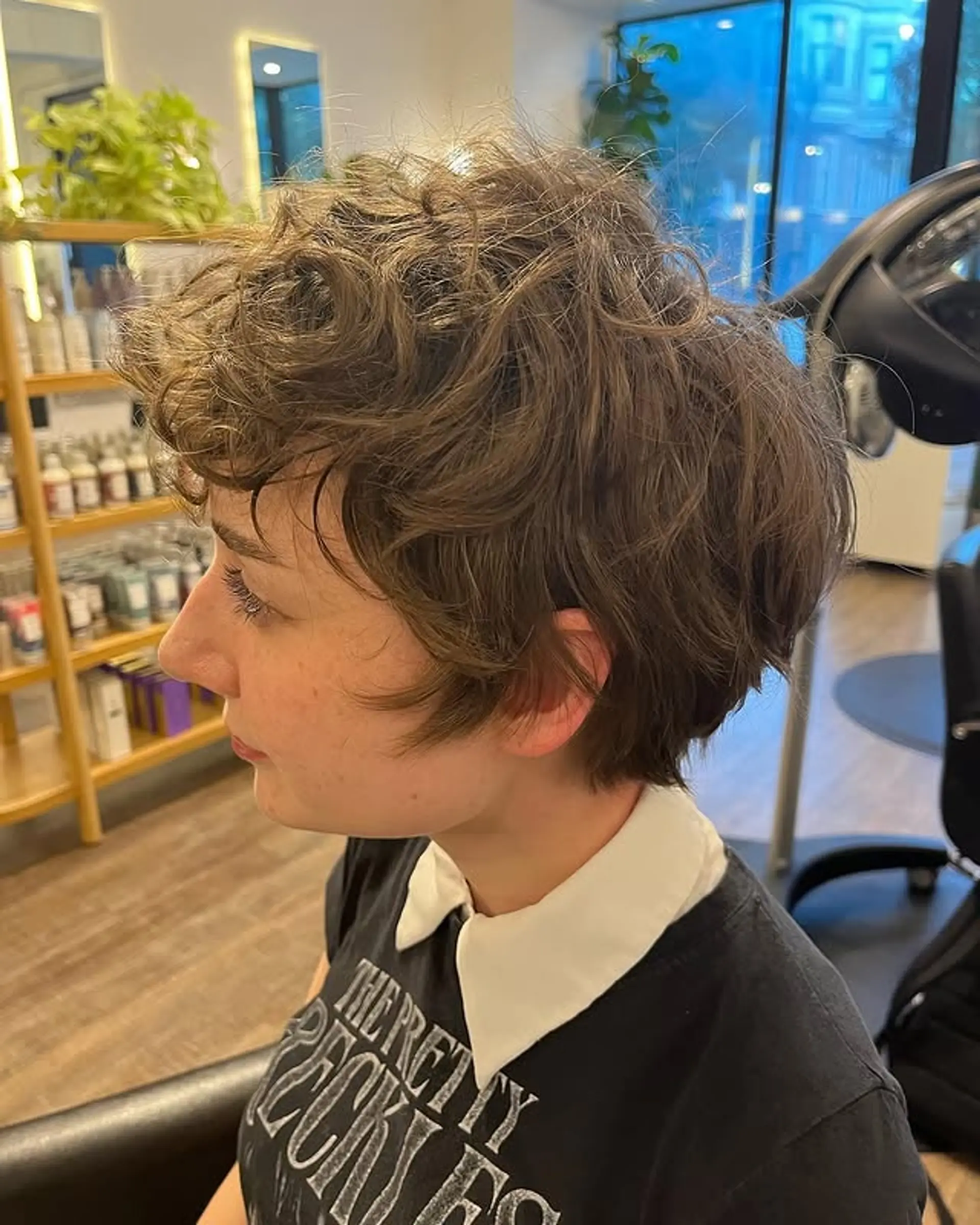 A textured pixie cut designed to showcase natural waves and create a low-maintenance, edgy look. 1