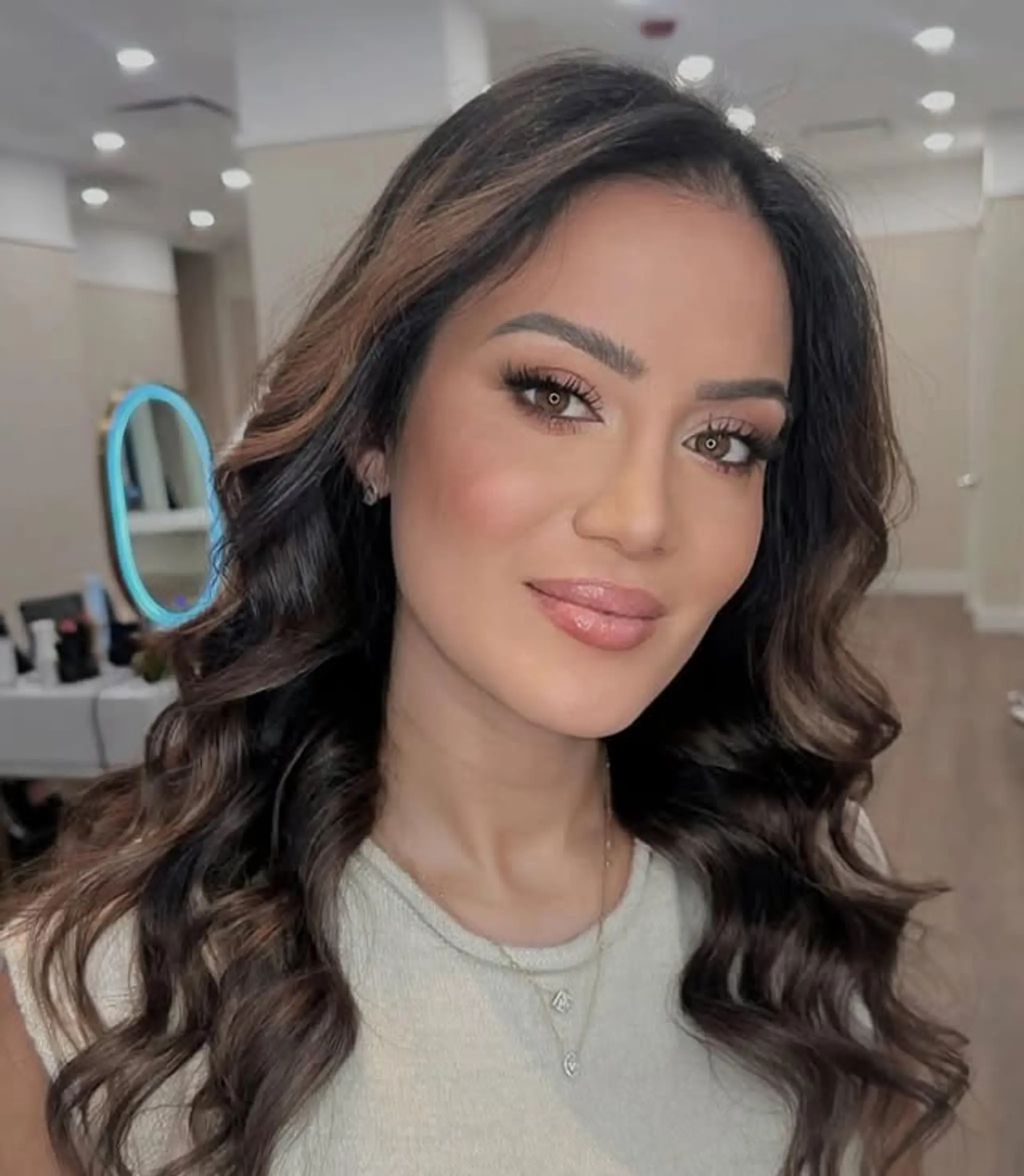 Long, voluminous waves with a seamless balayage color melt.