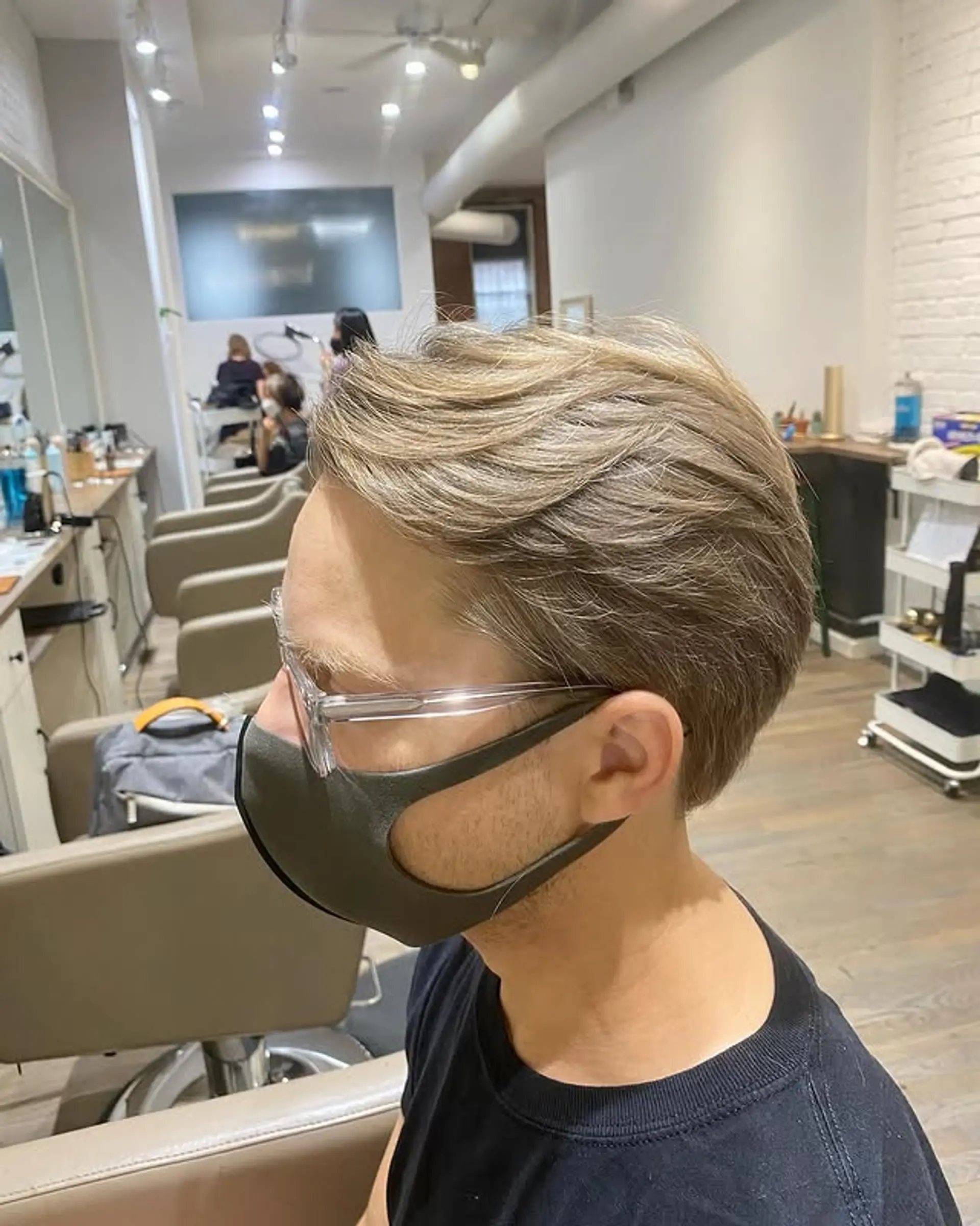 A stylish short haircut with textured layers and subtle highlights. 1