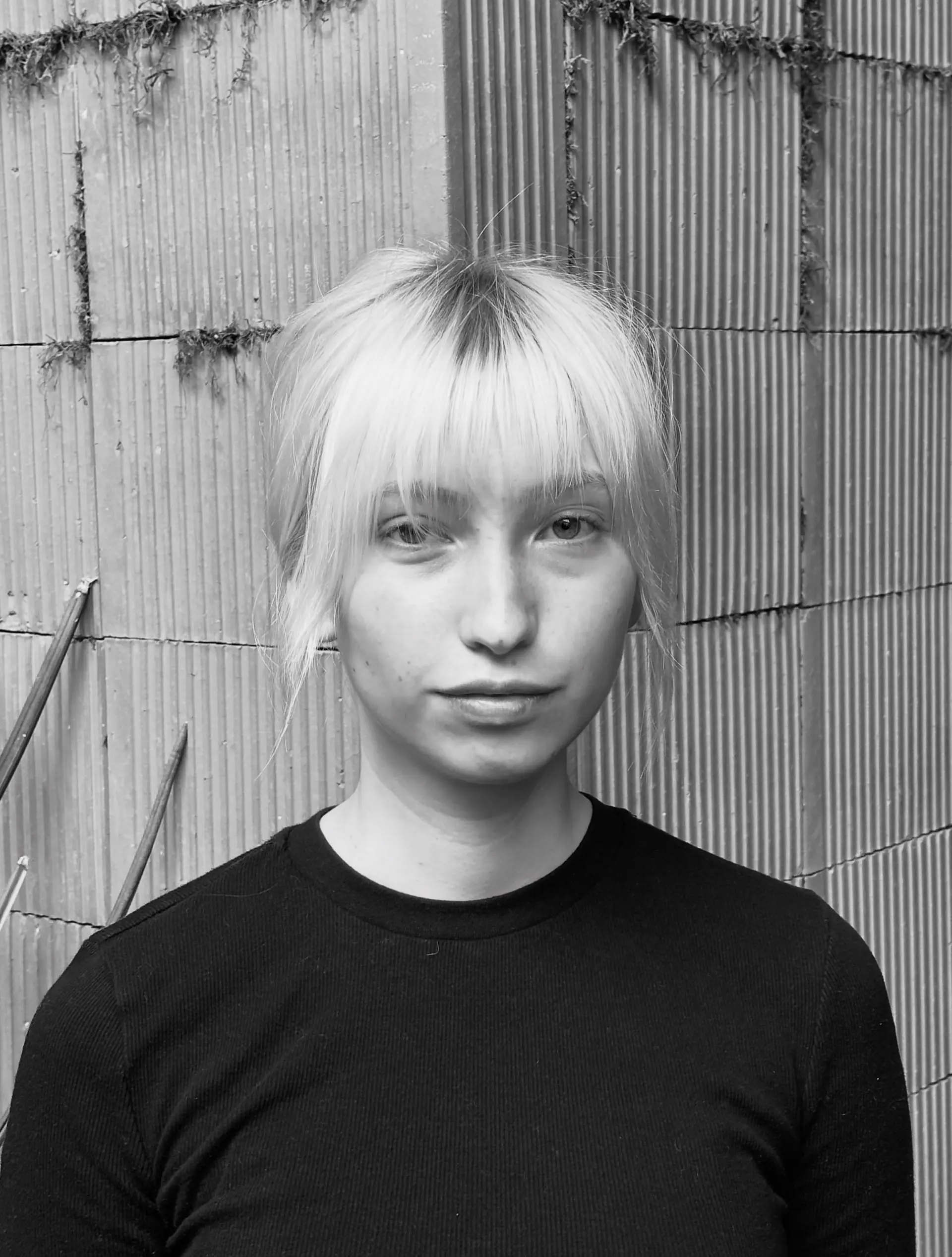 An effortless, chic updo featuring wispy full bangs and soft face-framing strands. 1