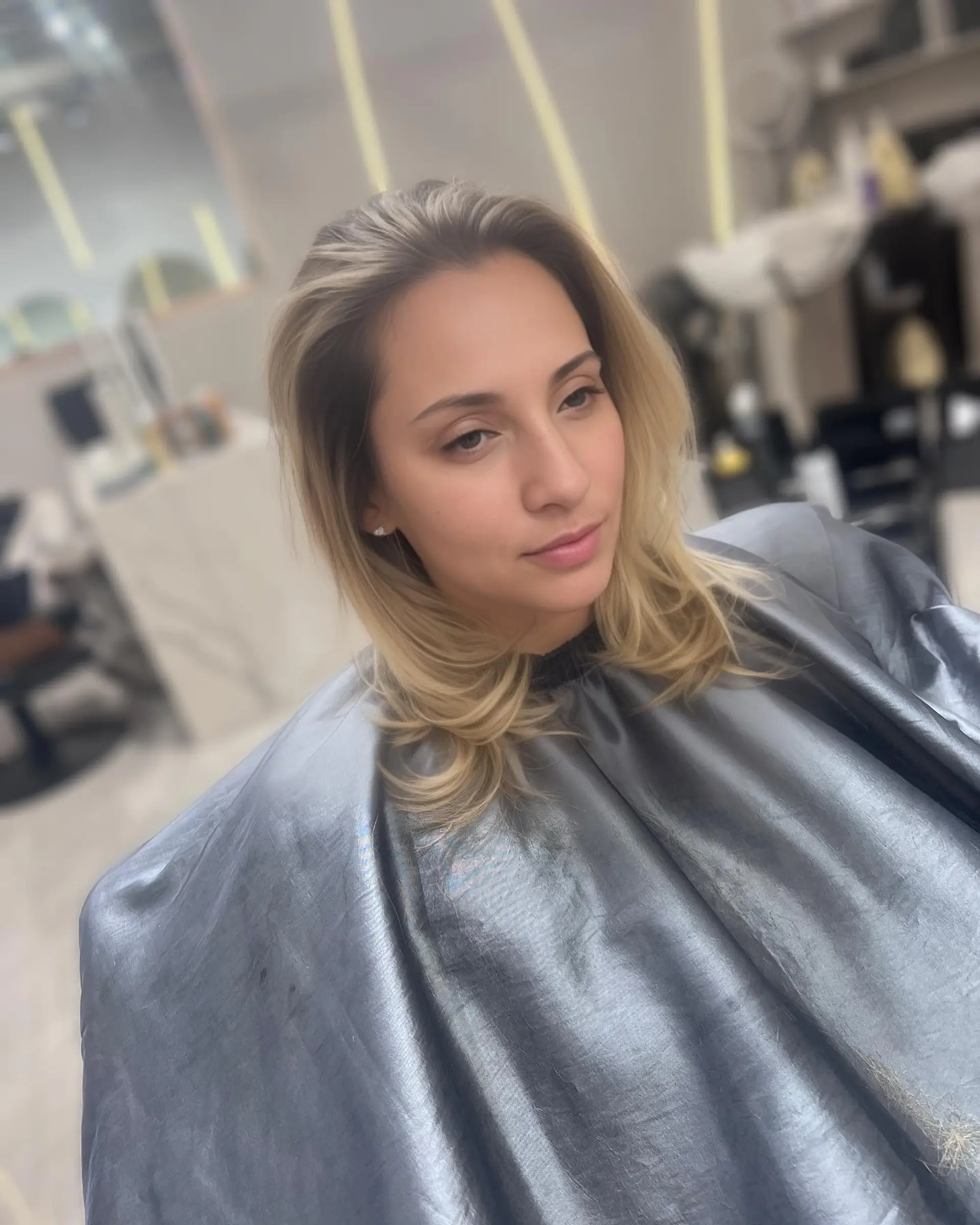 A medium-length layered lob with beachy waves. 2