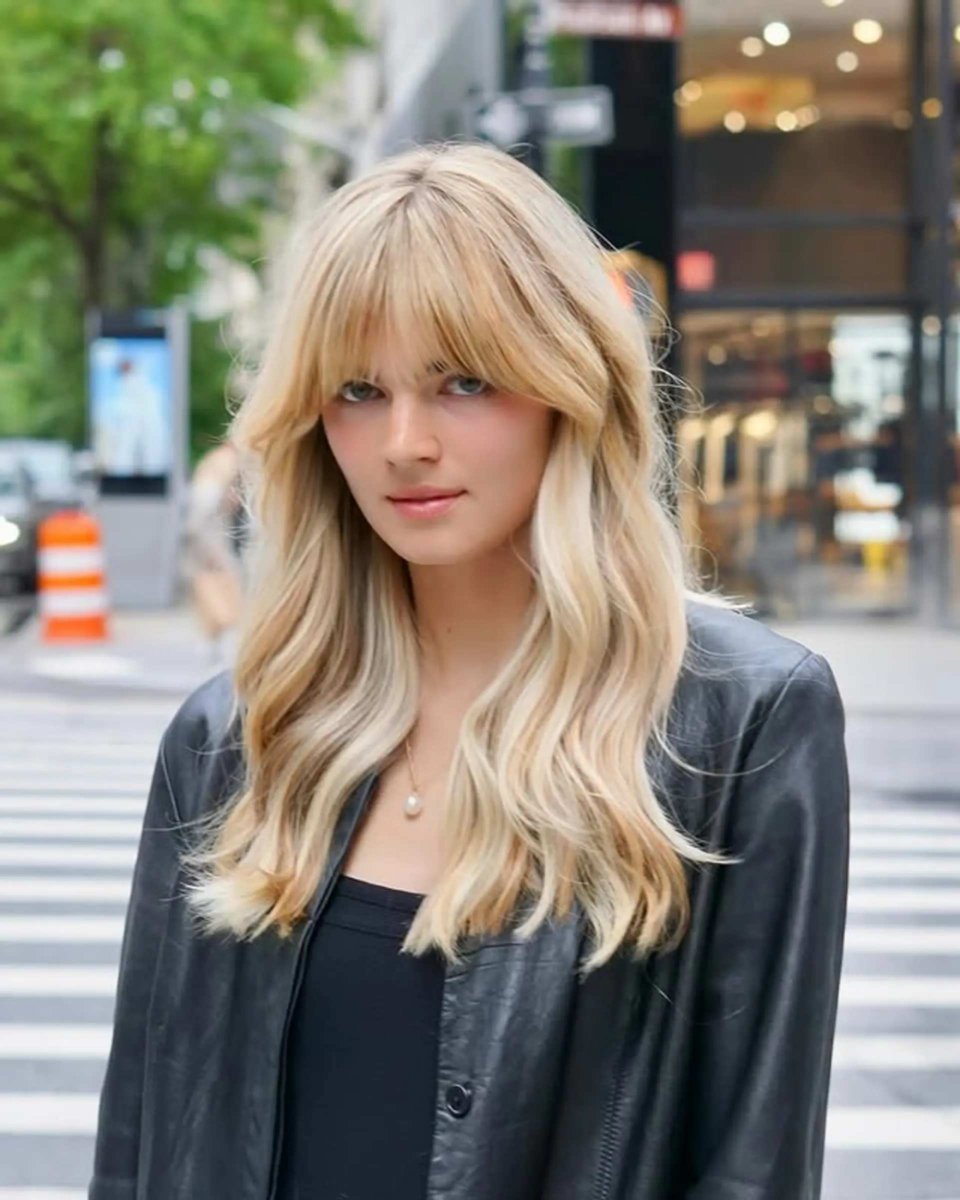 A modern shag with layered waves and face-framing curtain bangs. 1