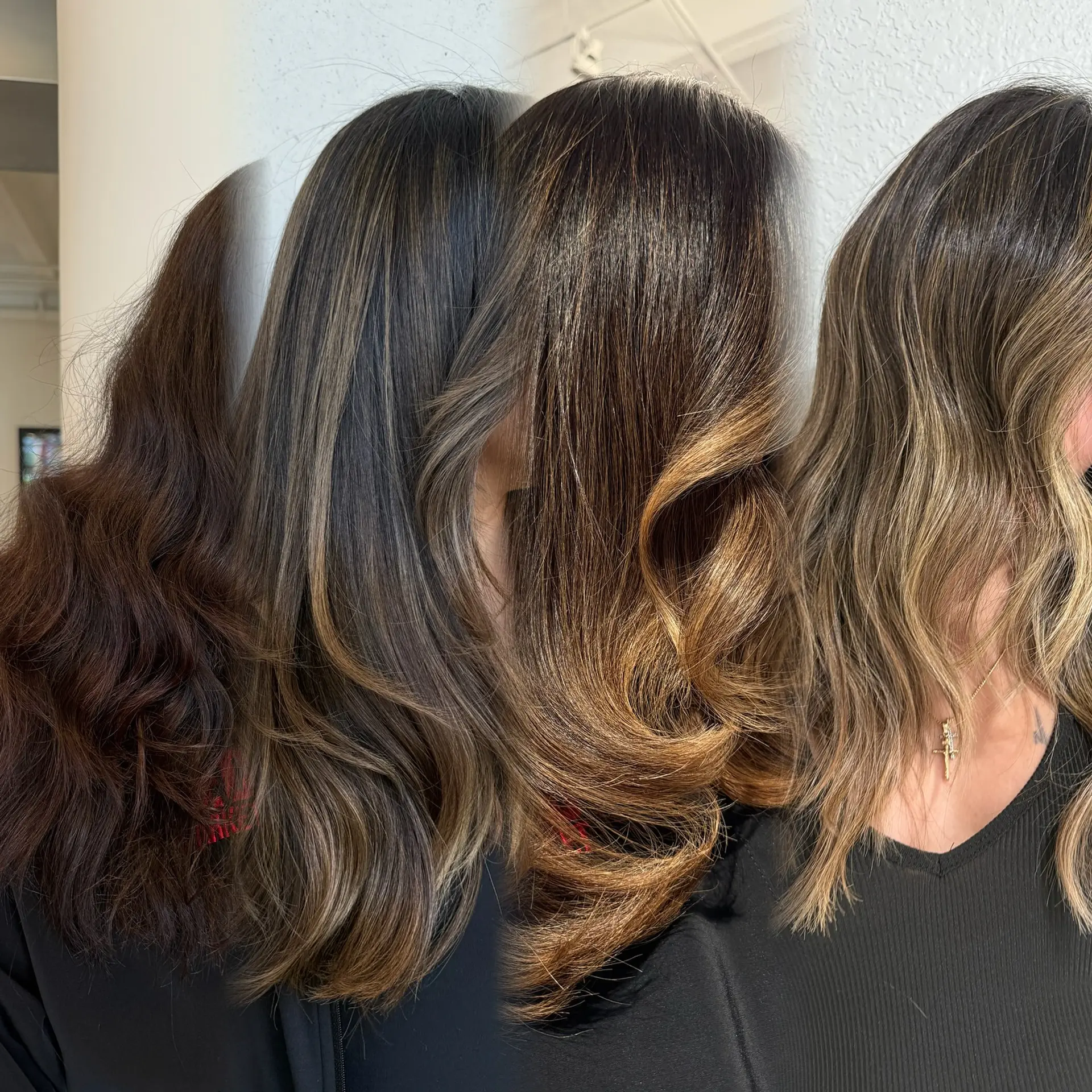 A dimensional hair transformation featuring dark brunette base hair melted into rich caramel and beige tones with soft waves. 1