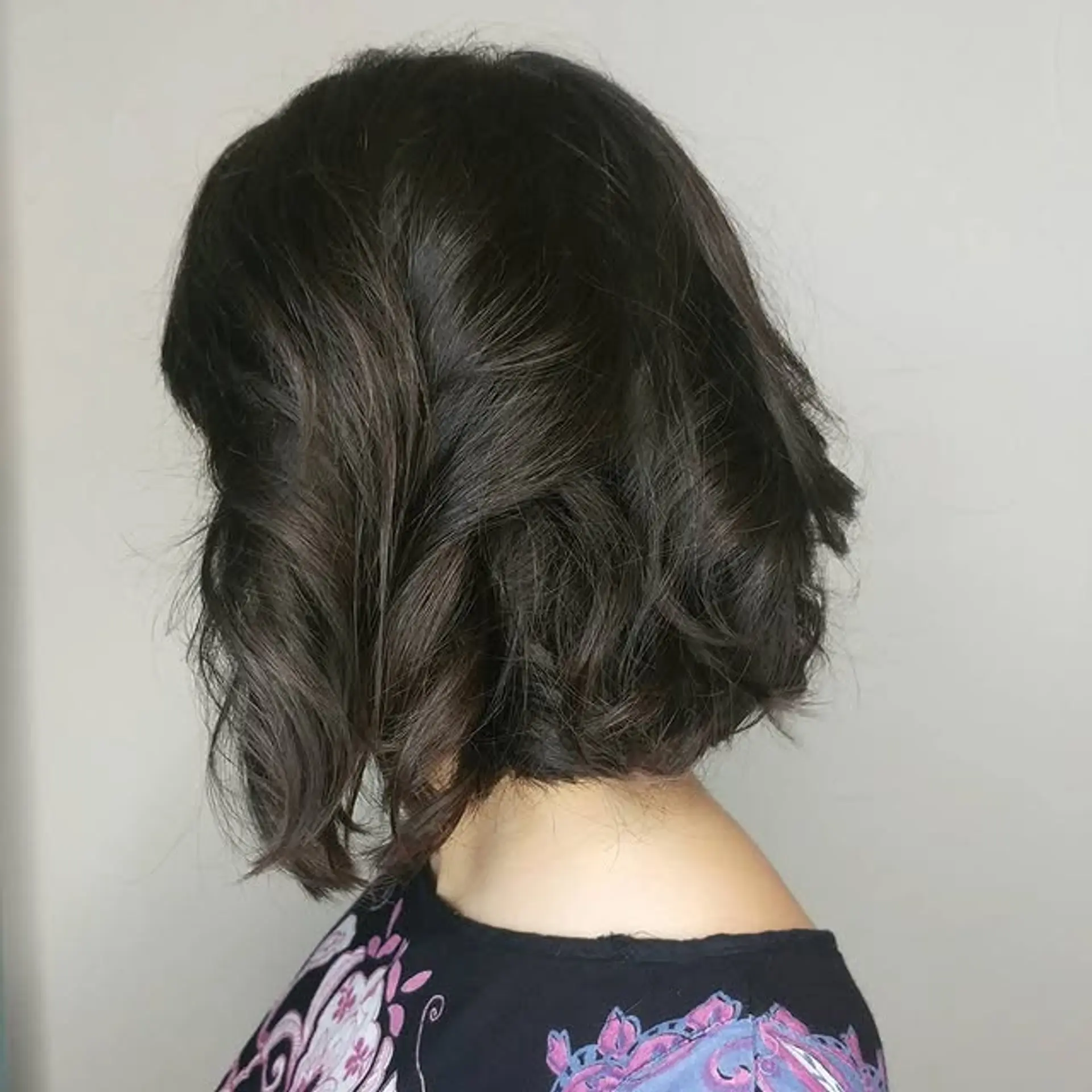 A stylish wavy lob with soft layers that create a natural, flowing look. 1