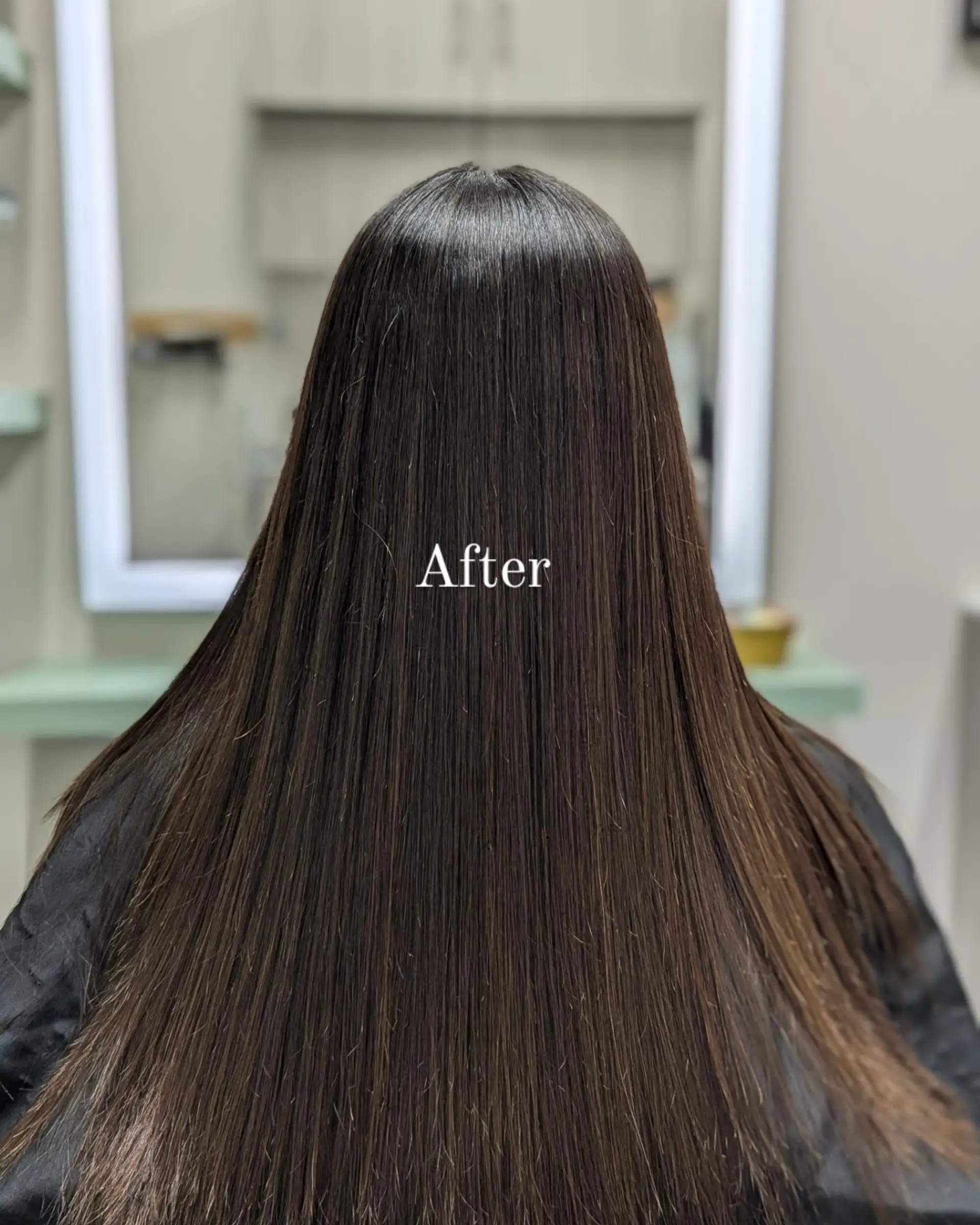 Ultra-sleek, pin-straight long hair with exceptional gloss and smooth texture seen from the back. 1