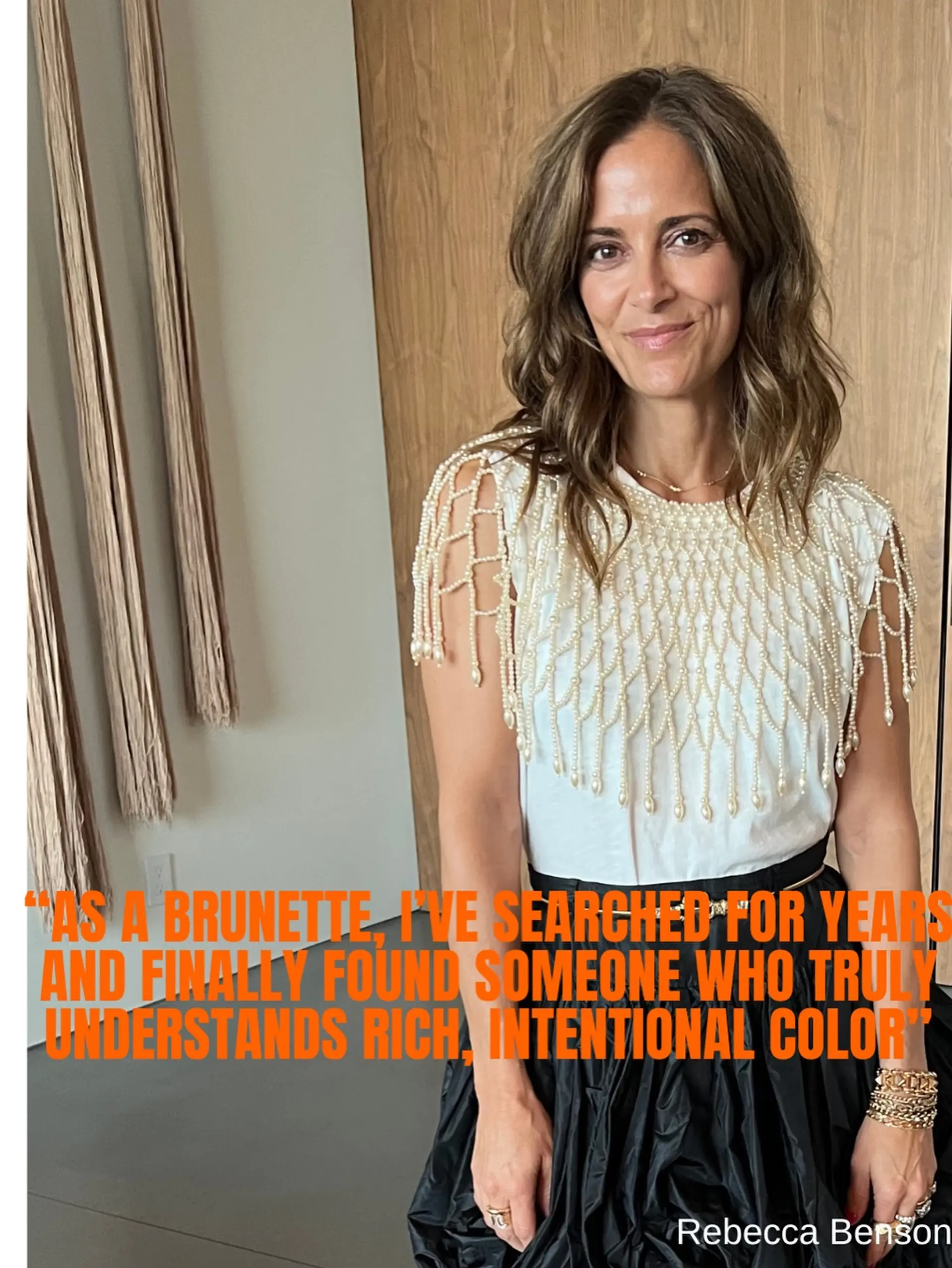 Medium-length dimensional brunette hair styled in soft, loose waves with a centered part. 1