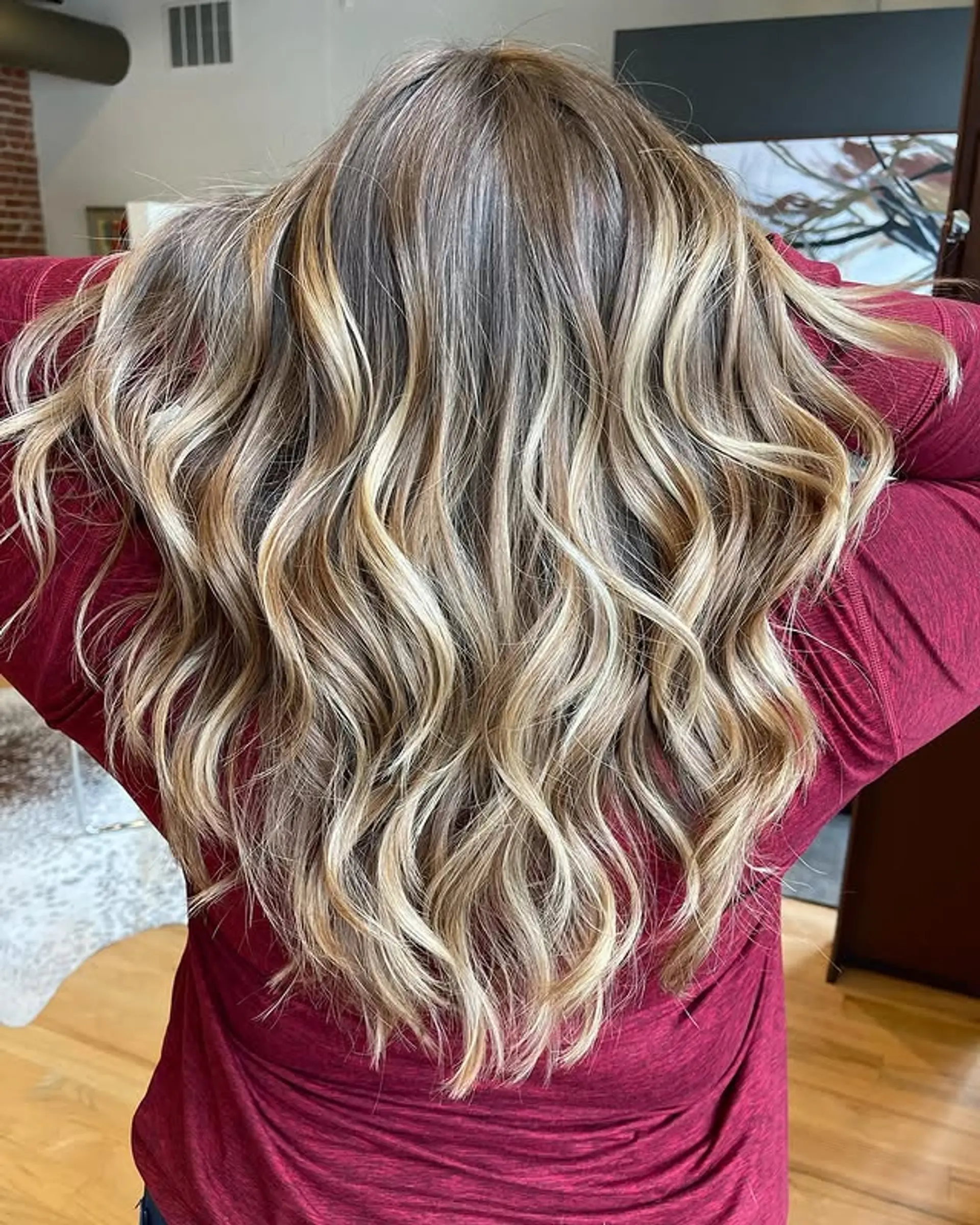 Long, wavy hair with a bronde balayage and blonde highlights. 1
