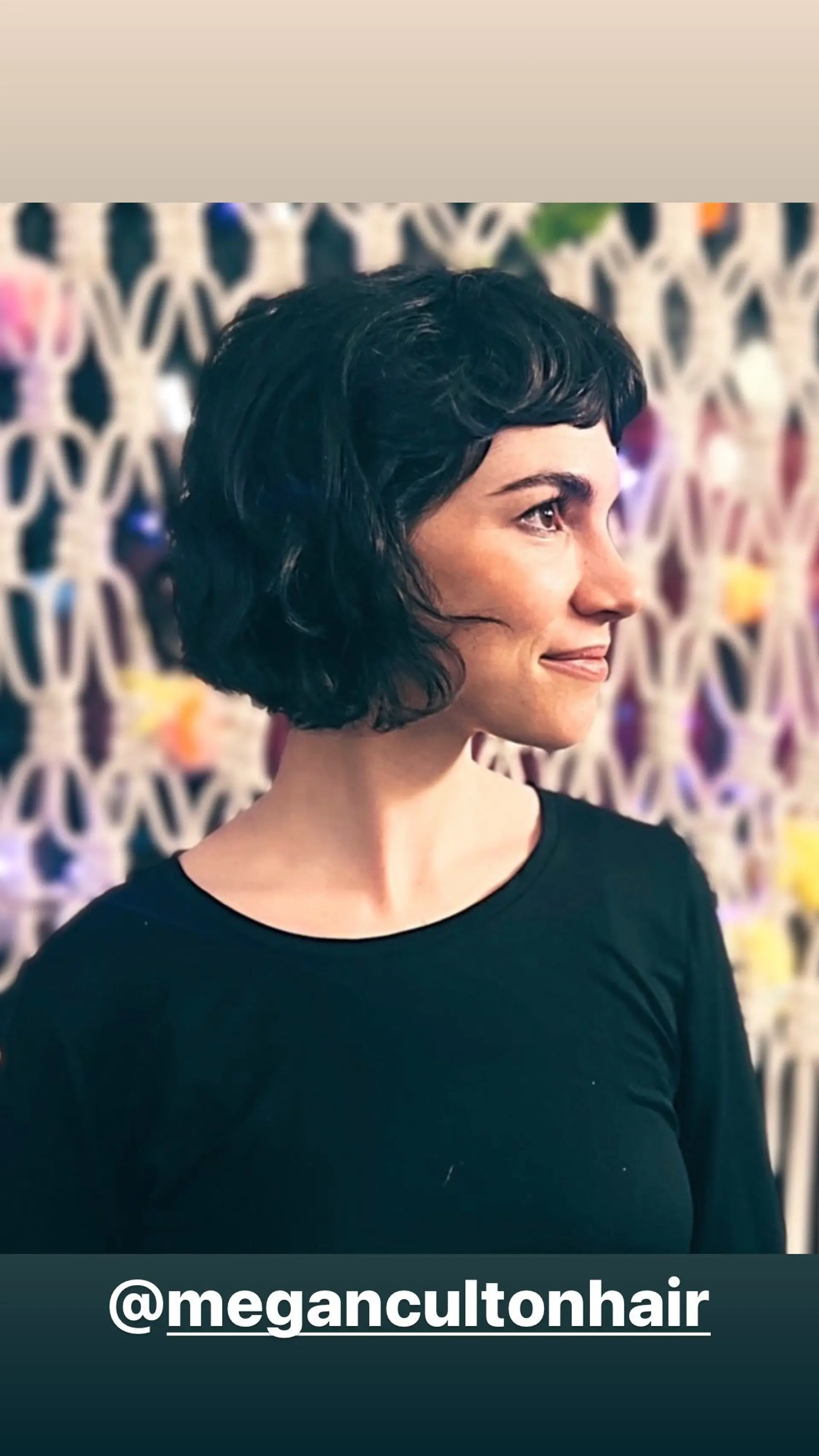 A chin-length wavy bob with short, face-framing baby bangs. 1