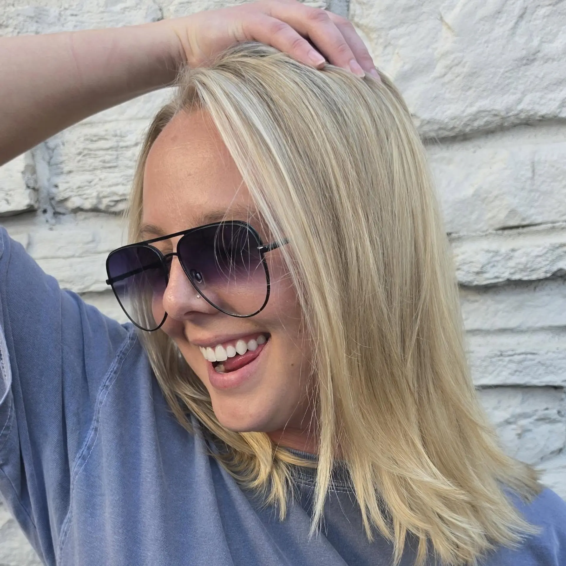 Shoulder-length straight hair featuring bright, multi-tonal buttery blonde highlights and subtly textured ends. 1