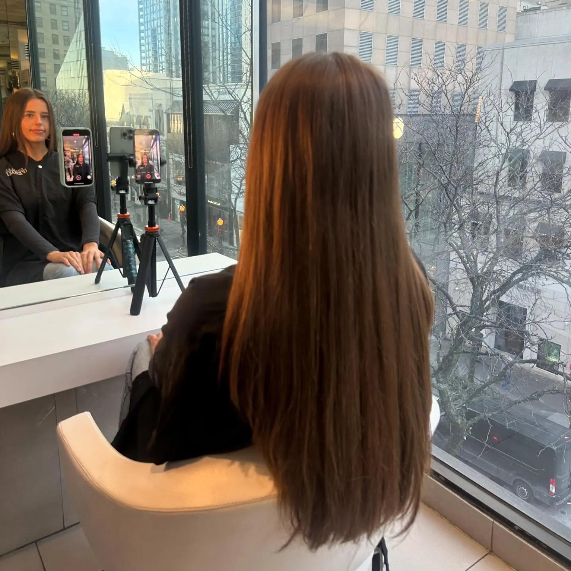Extra-long straight bronde hair styled with a smooth, glossy finish extending past the waist. 1