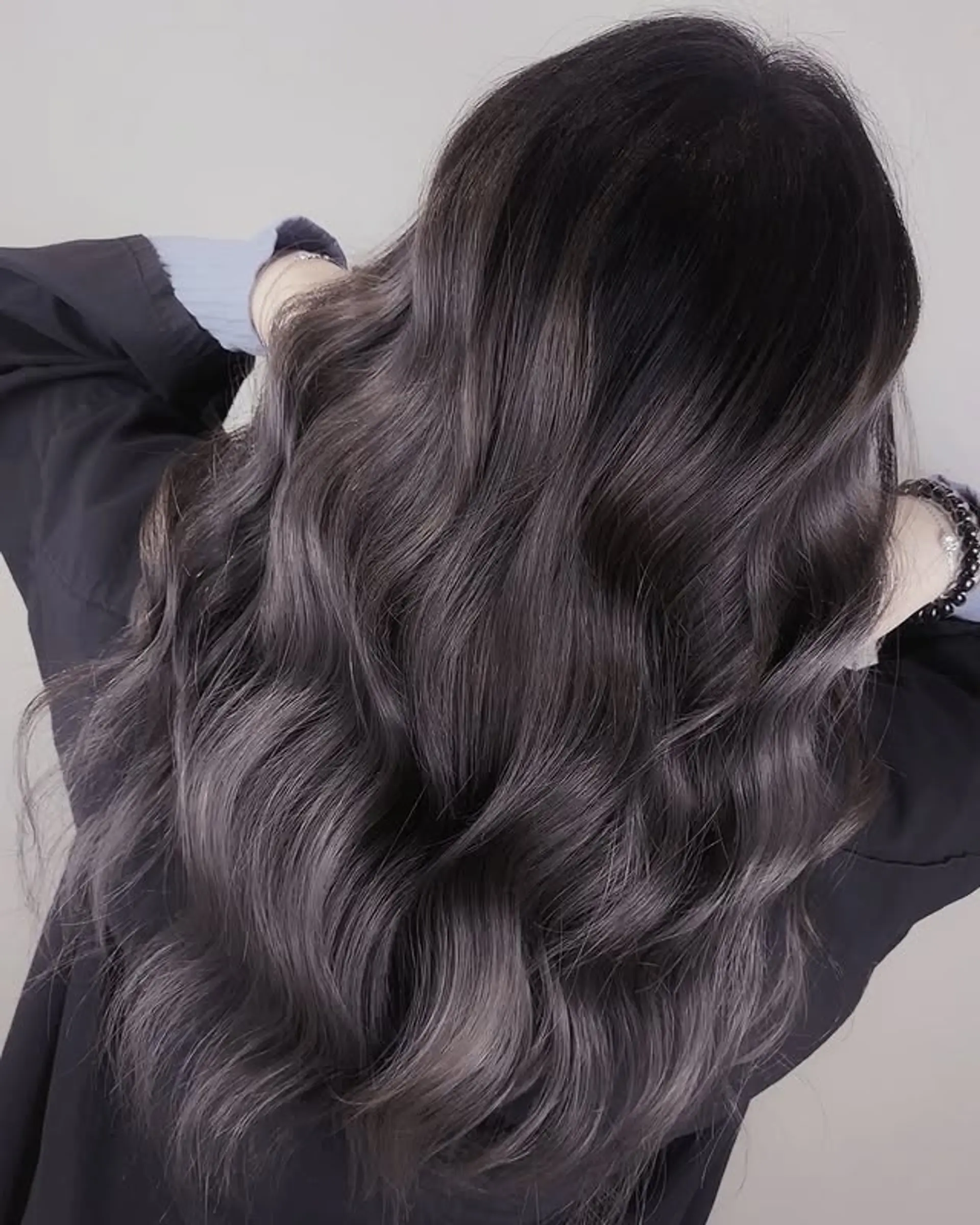 Long wavy hair with a silver smokey balayage. 1