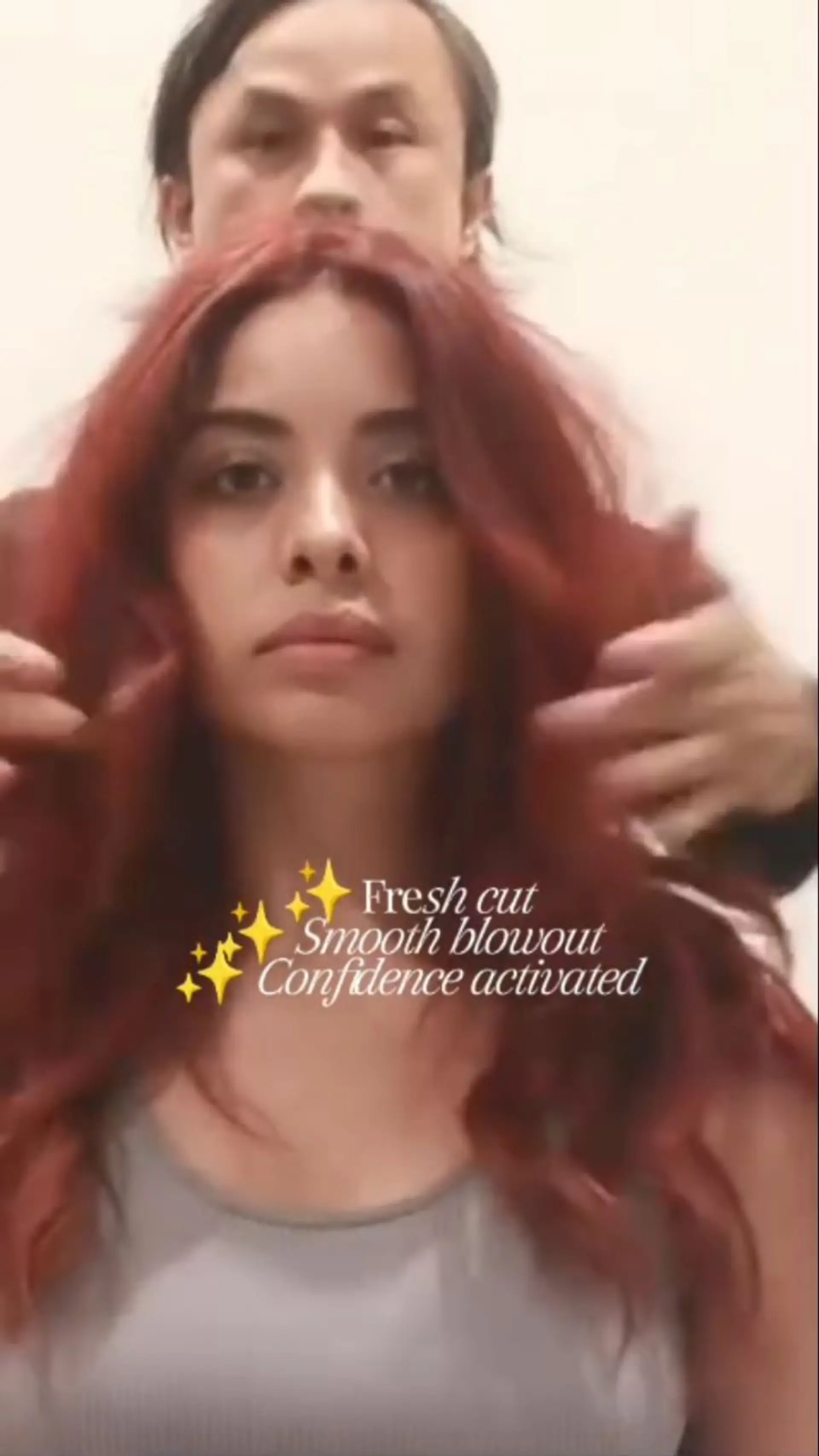 Vibrant auburn red hair with soft layers, styled in a voluminous blowout with loose waves. 1