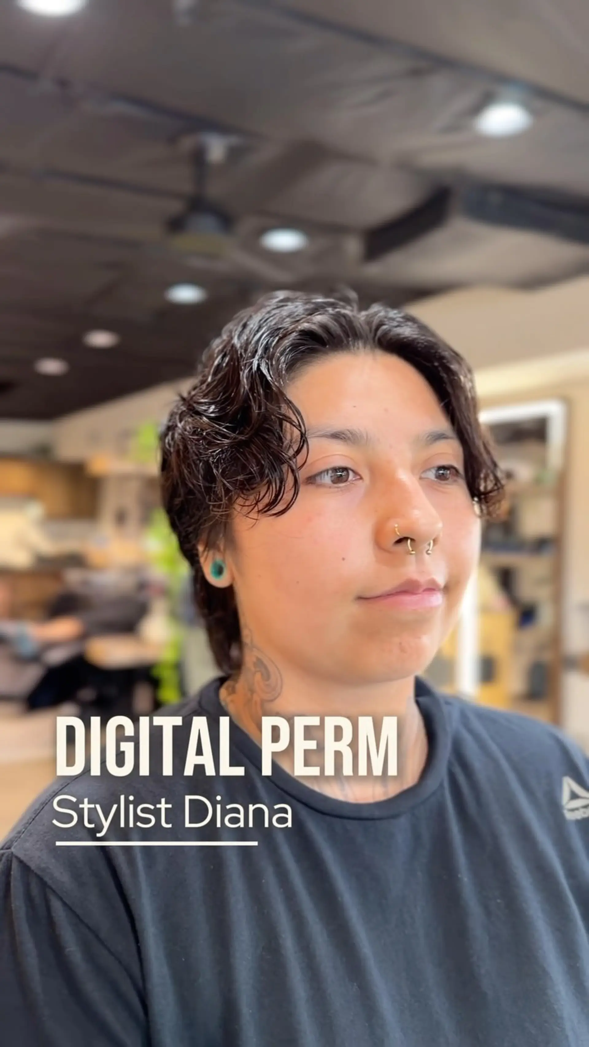 A short, textured cut enhanced with soft, tousled waves created via a digital perm. 1