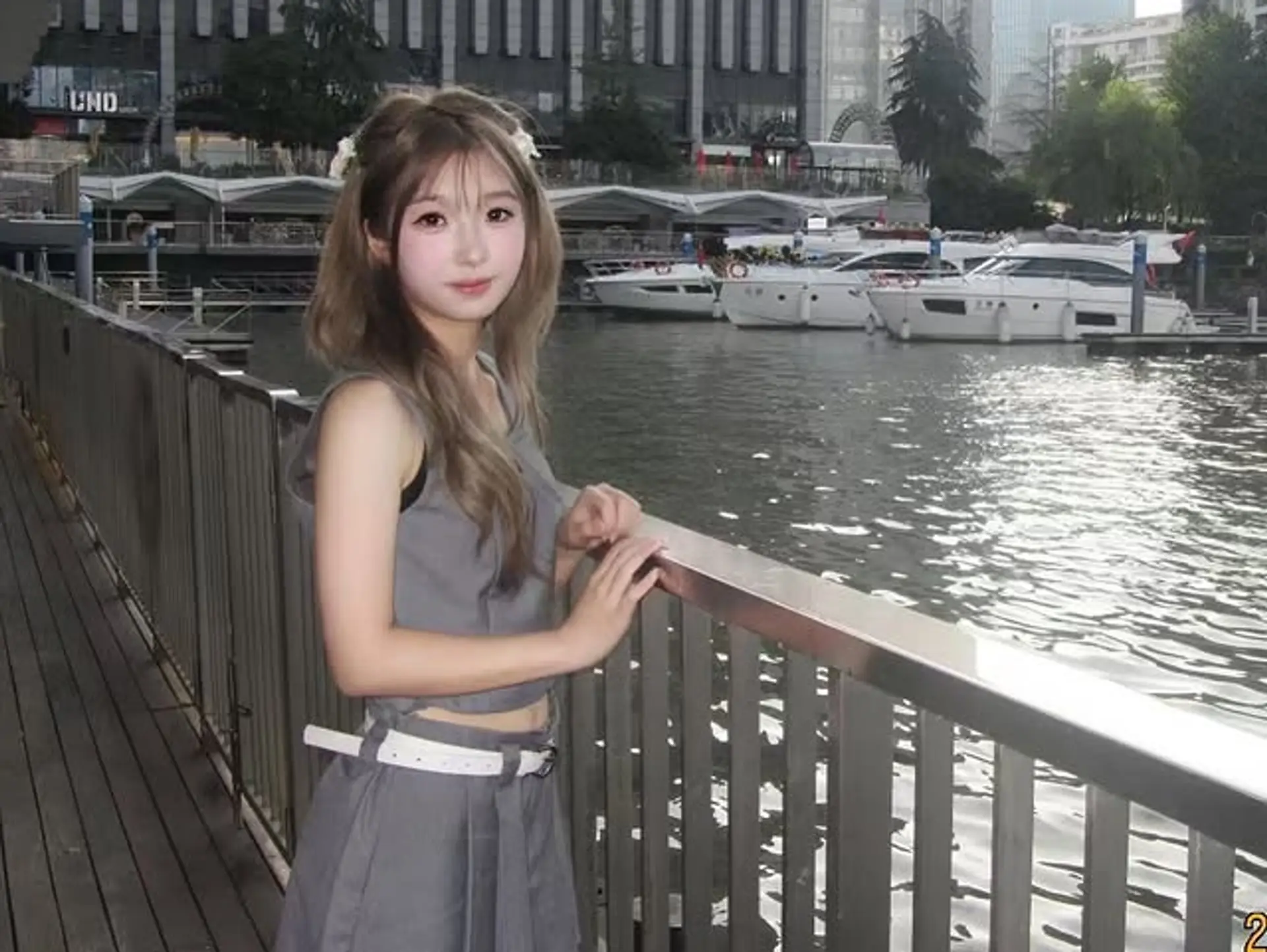 Medium-length wavy ash-brown hair styled with soft, face-framing layers and a relaxed middle part, creating an effortlessly chic look. 1