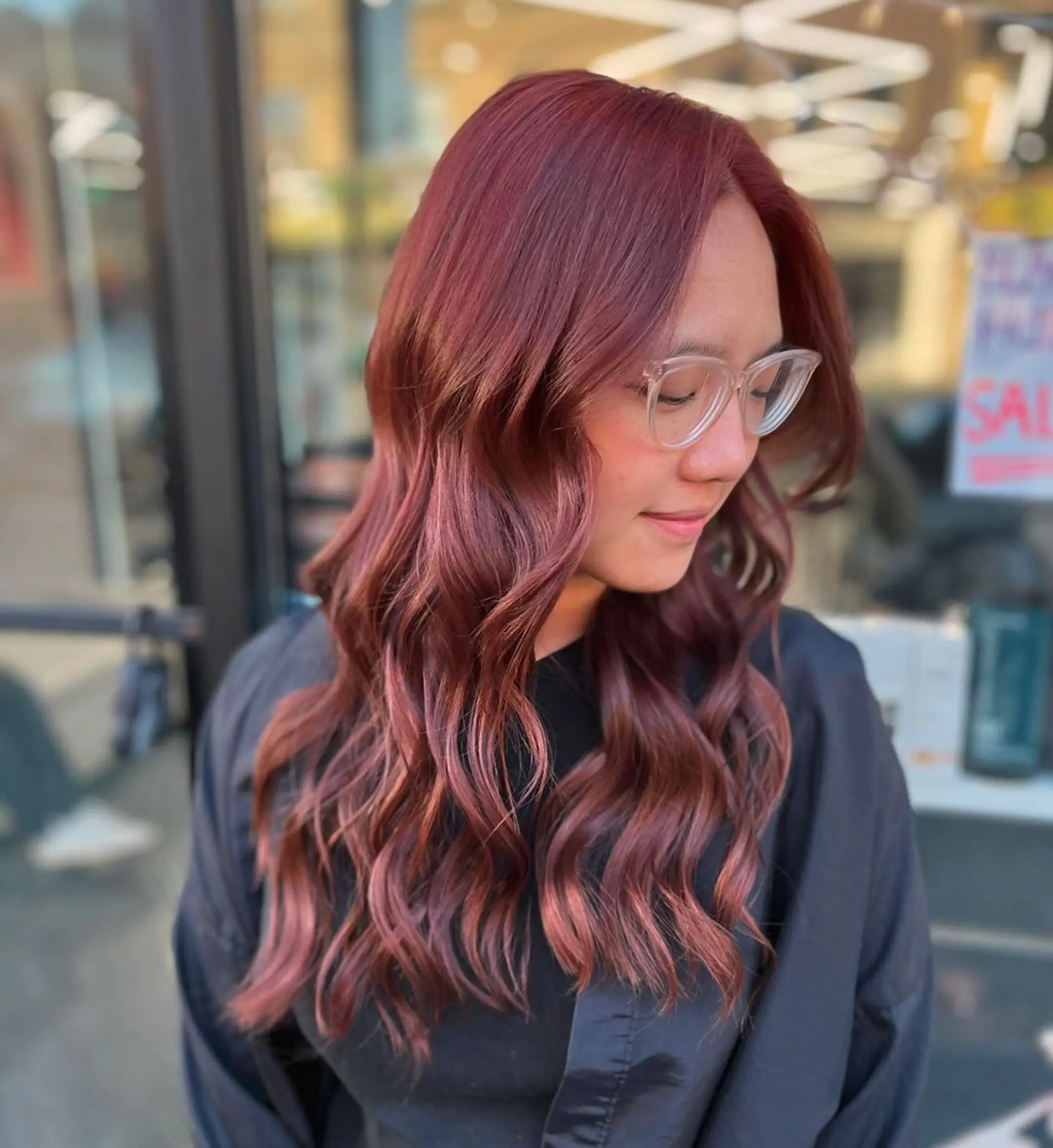 Long, wavy, crimson and burgundy hair with a glossy finish and natural middle part.
Stylist - @xcellent_jason