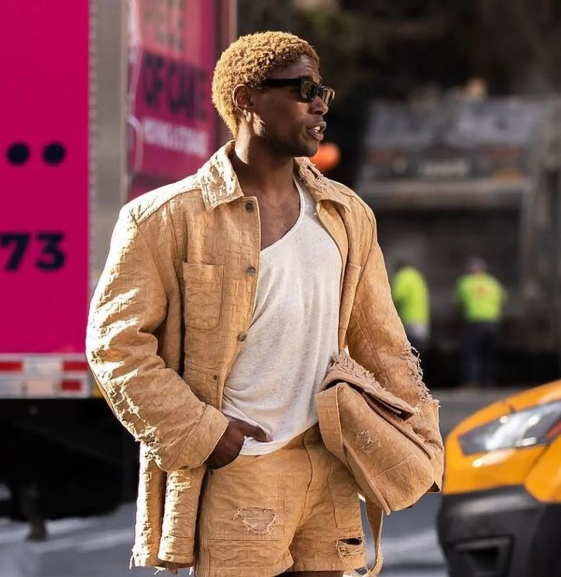 The curly hair is styled in a very short buzz cut with a striking blonde color and neatly tapered sides

LIGHTDRENCH: @okdeon

BASE: 8Go/8Cr fusion
WASH: tobacco color conditioner @davinesofficial
 1