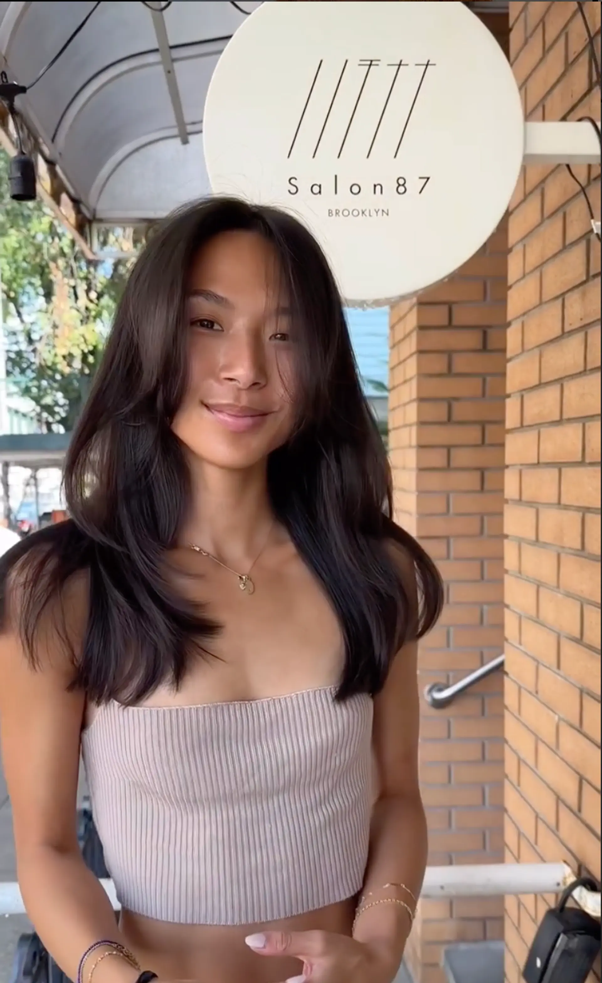 Long, sleek layers with feathered ends and a center part that adds symmetry and shine. 2