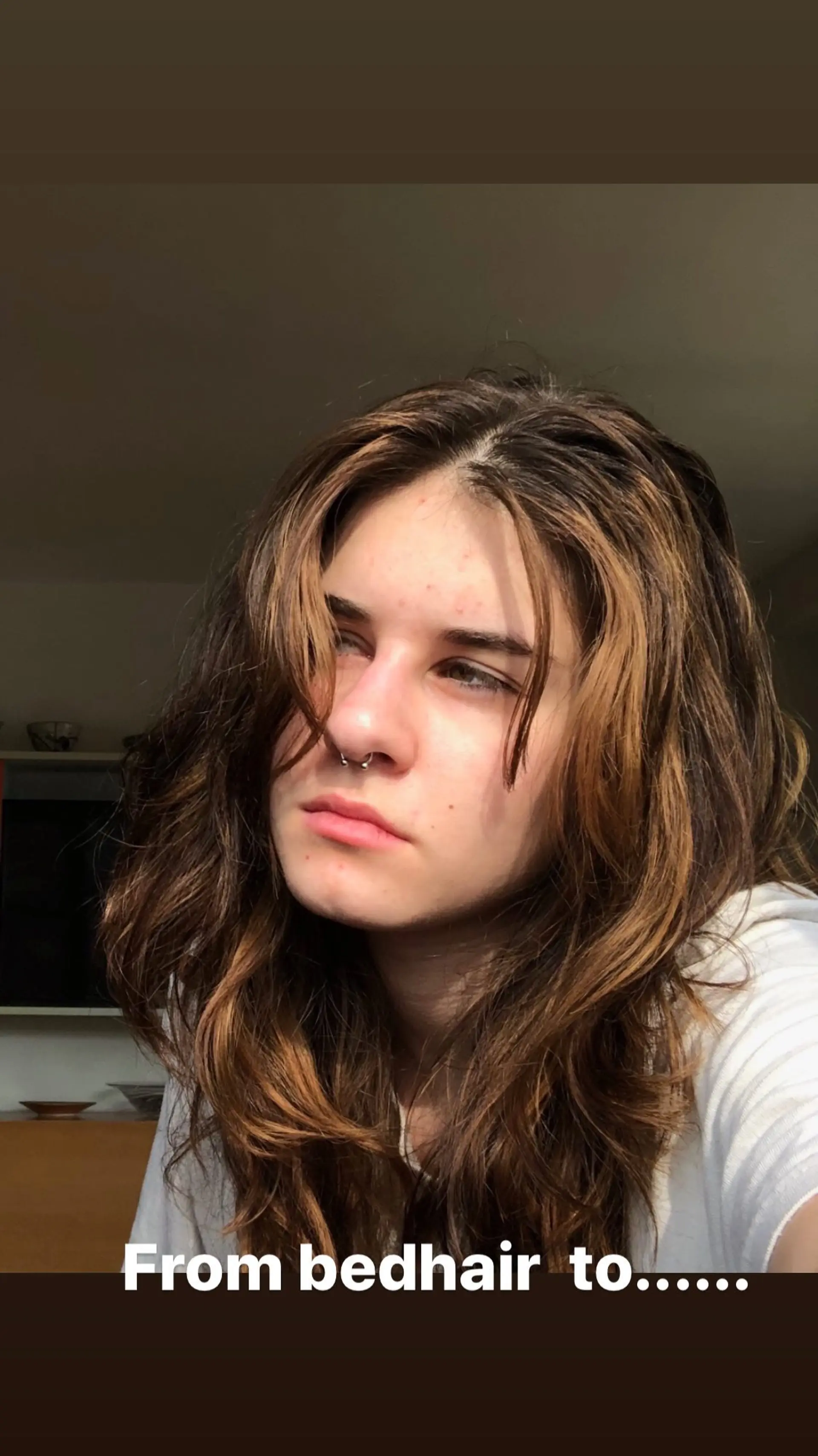 Long, layered, wavy hairstyle with face-framing highlights. 1